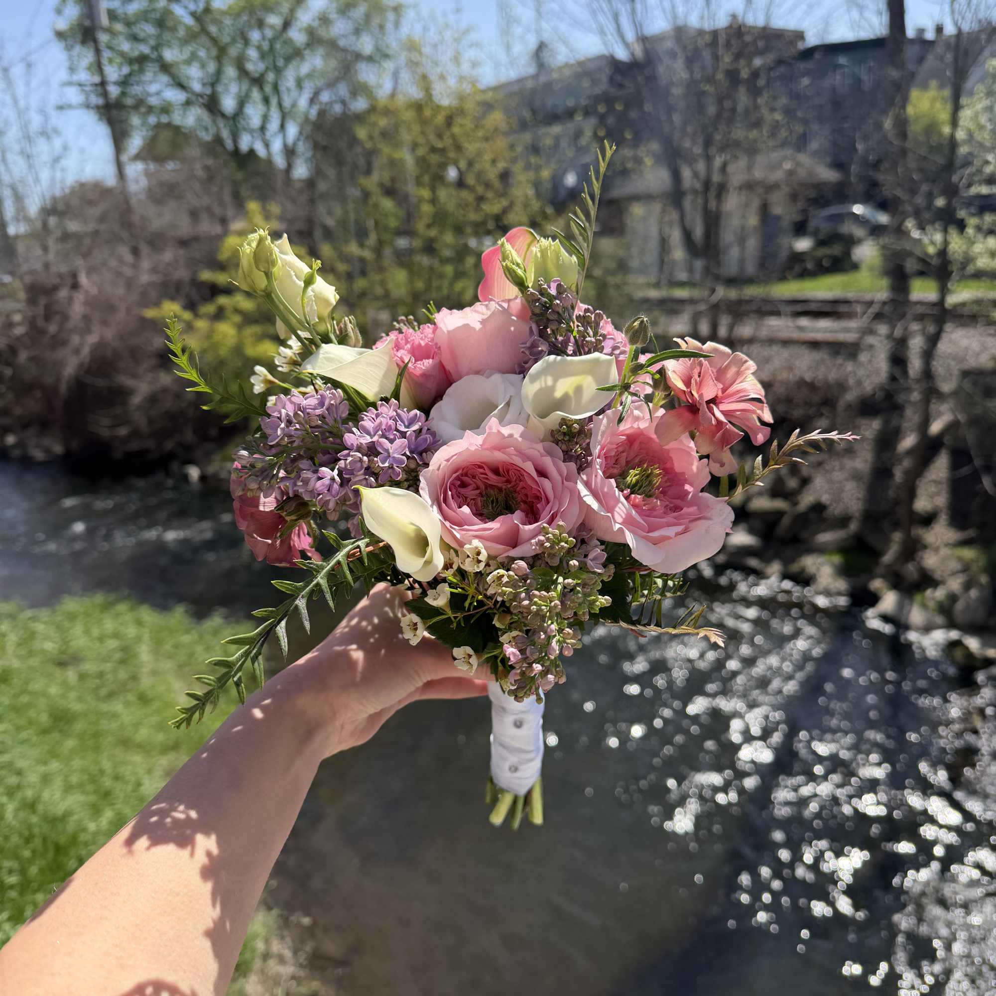 A delicate hand-tied prom bouquet designed to complement a formal gown and