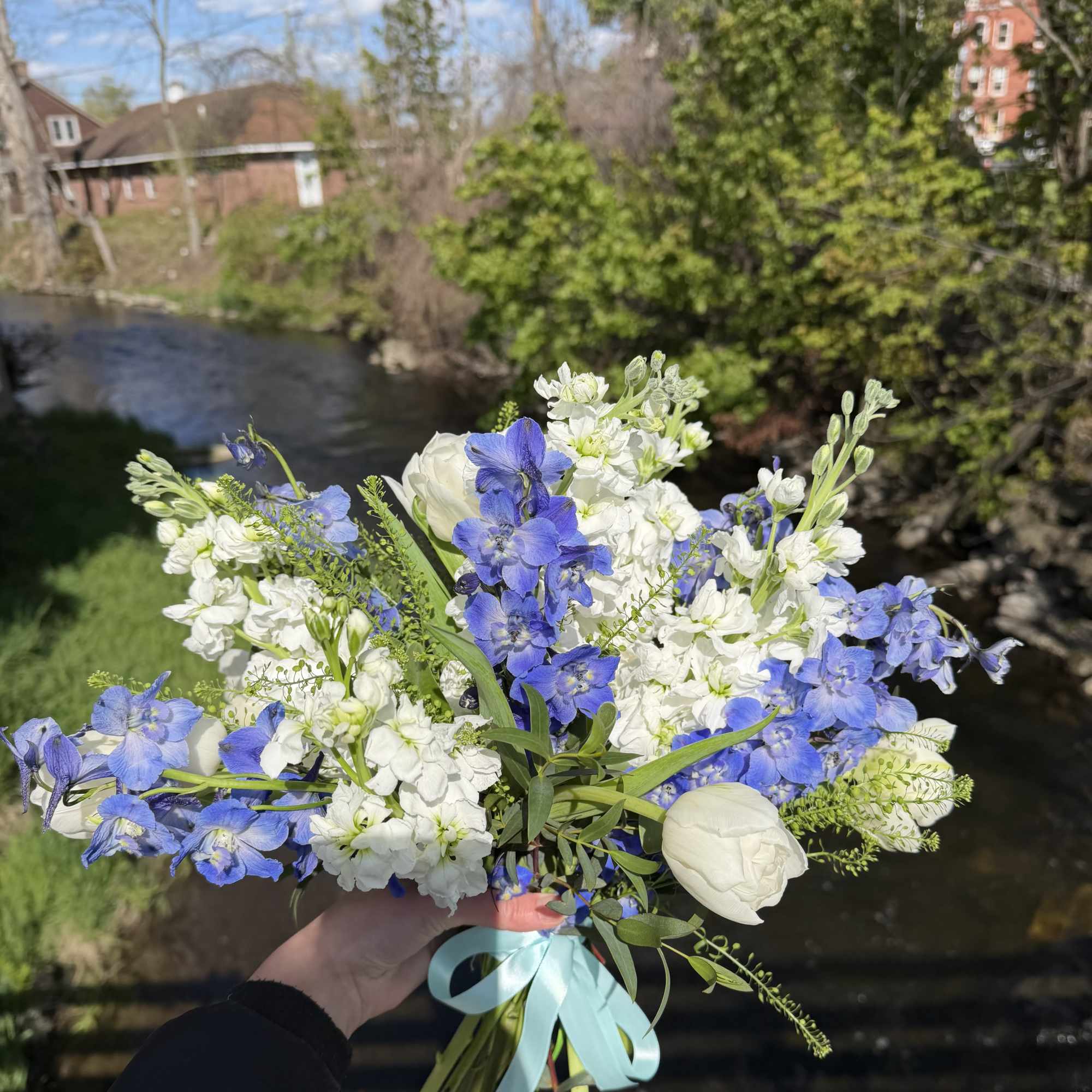 A delicate hand-tied prom bouquet designed to complement a formal gown and