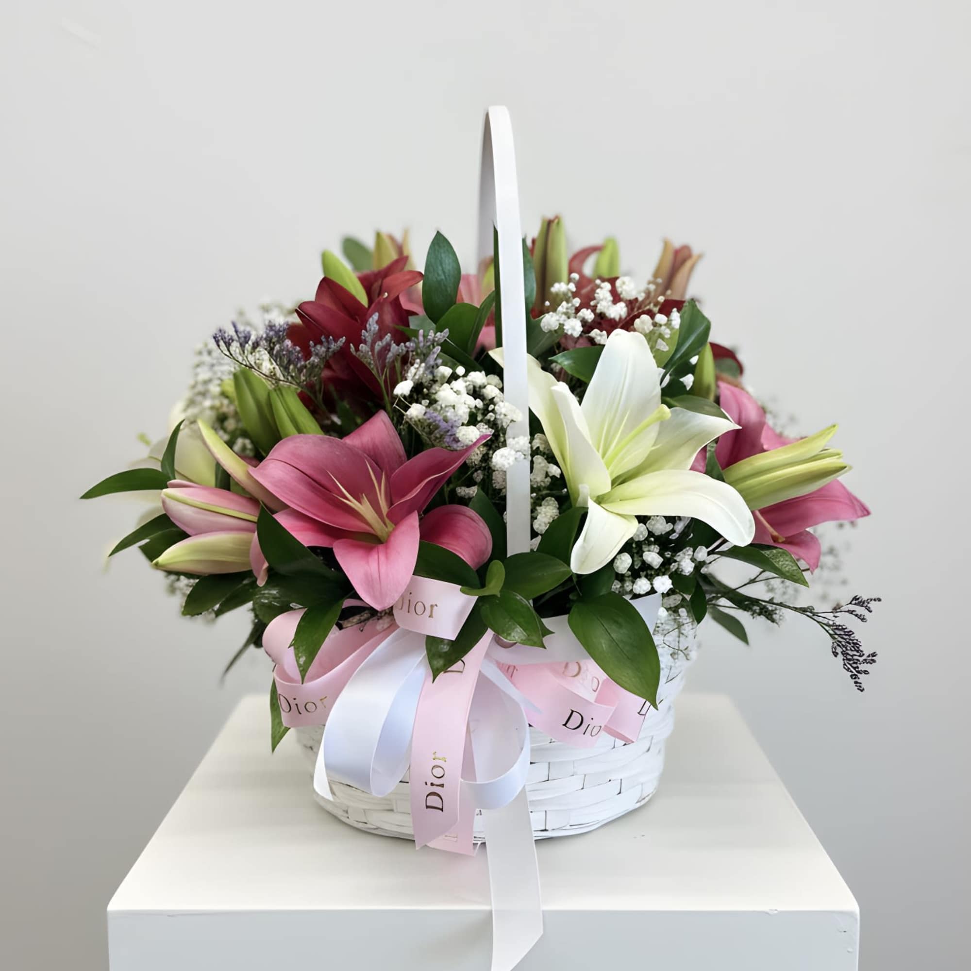 A charming wooden basket filled with a radiant mix of colorful lilies