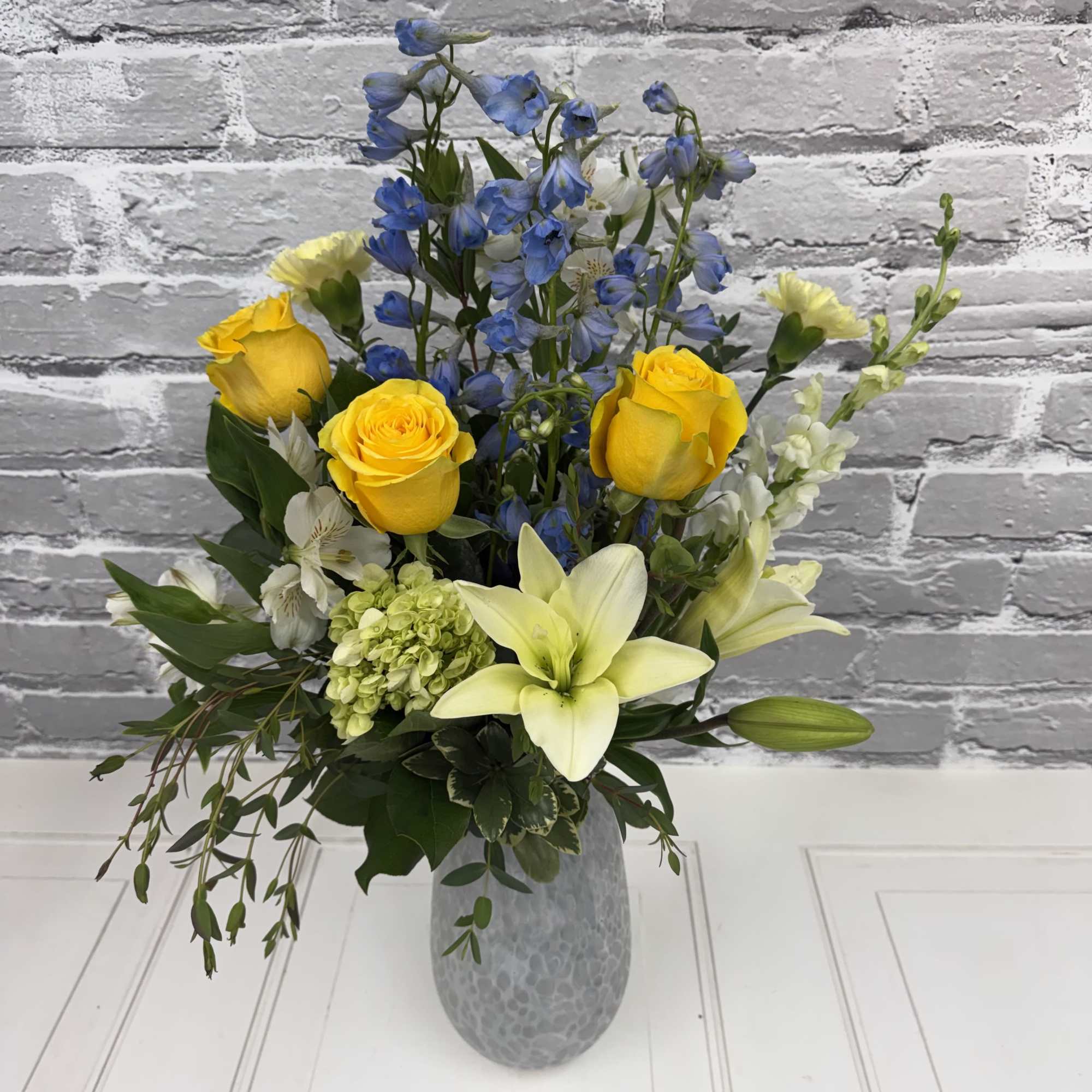 Gorgeous hand-blown vase with a white iridescent finish! Beautiful yellow, white and