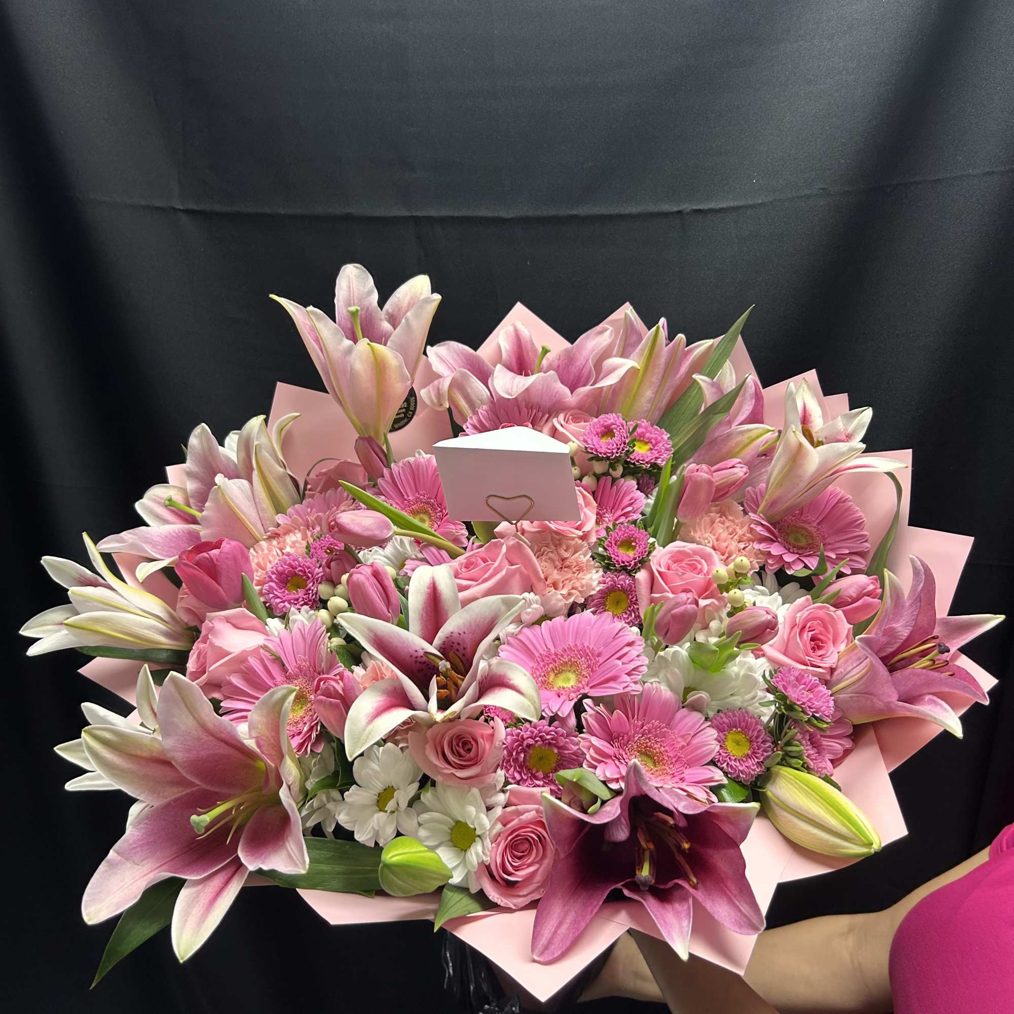 A mixed bouquet with pink and white colored flowers. The color of