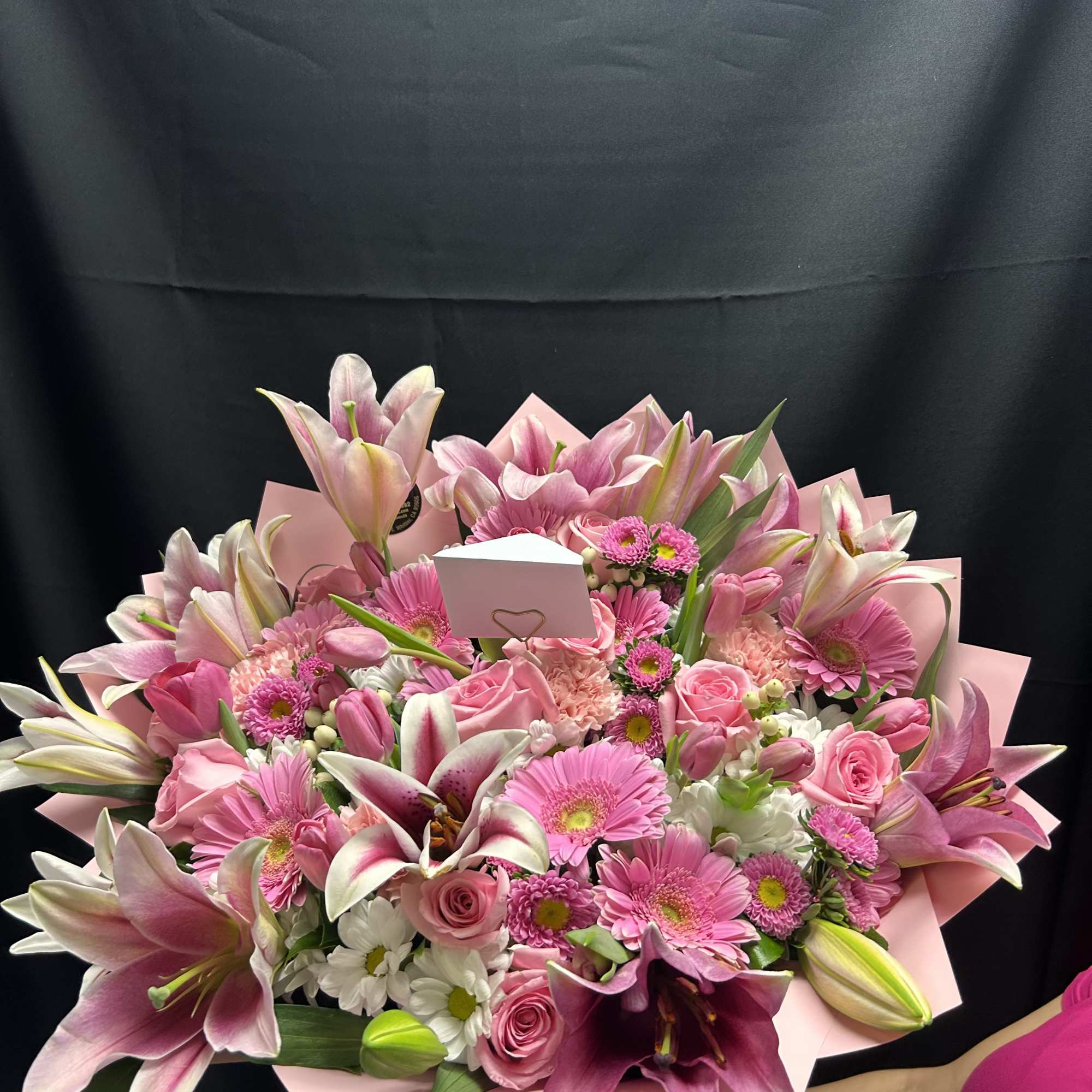 A mixed bouquet with pink and white colored flowers. The color of