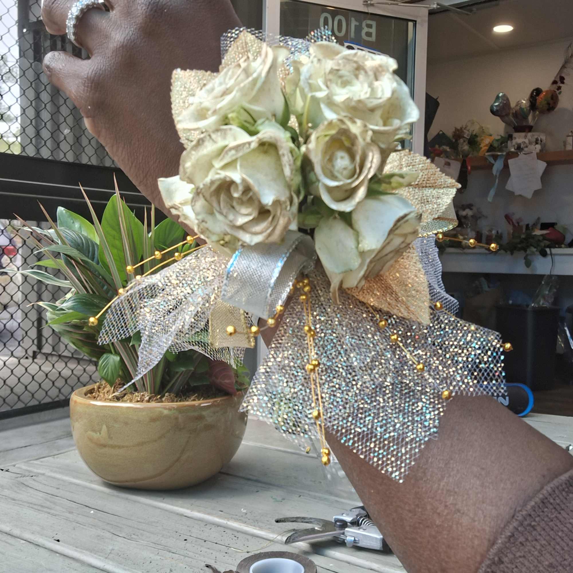 White rose wrist corsage with silver ribbon and glittery mesh