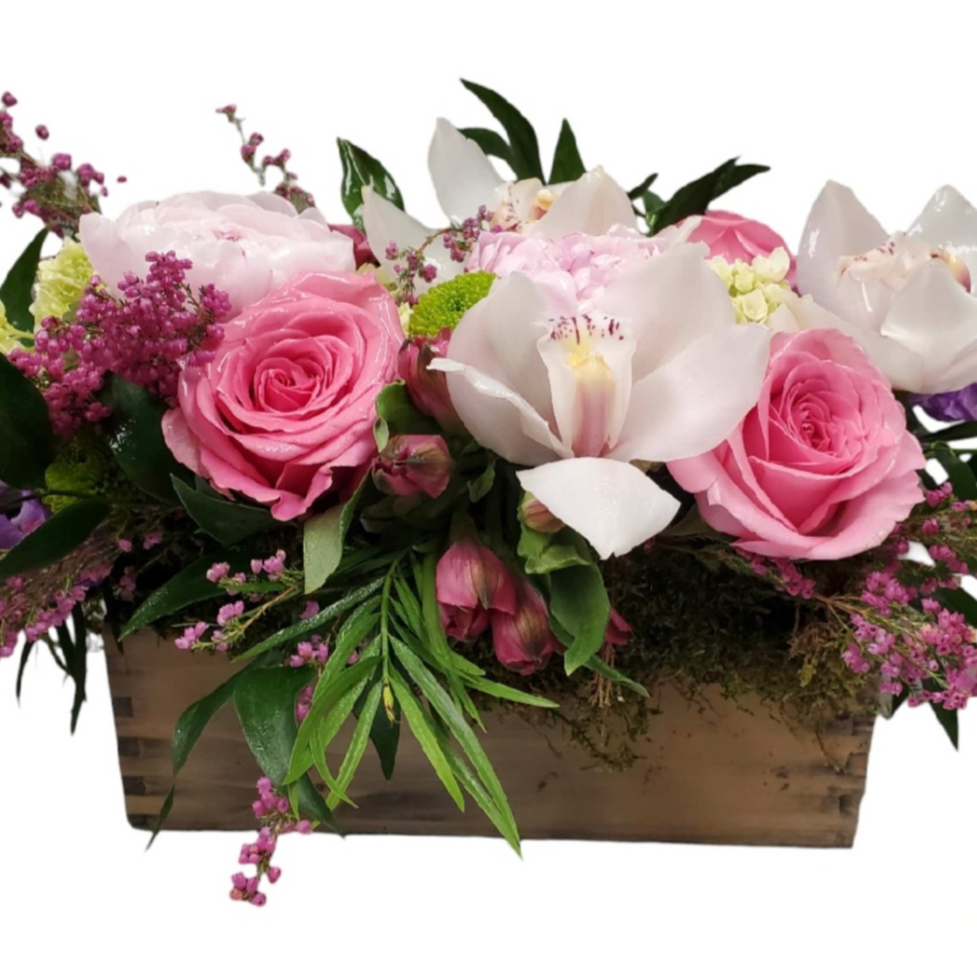 Pink roses and white orchids arranged in a wooden box