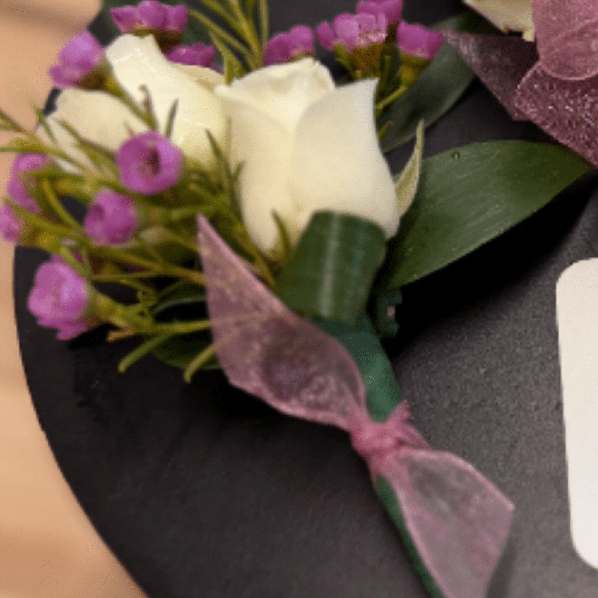A classic red rose boutonni&egrave;re that compliments any suit. Perfect for prom