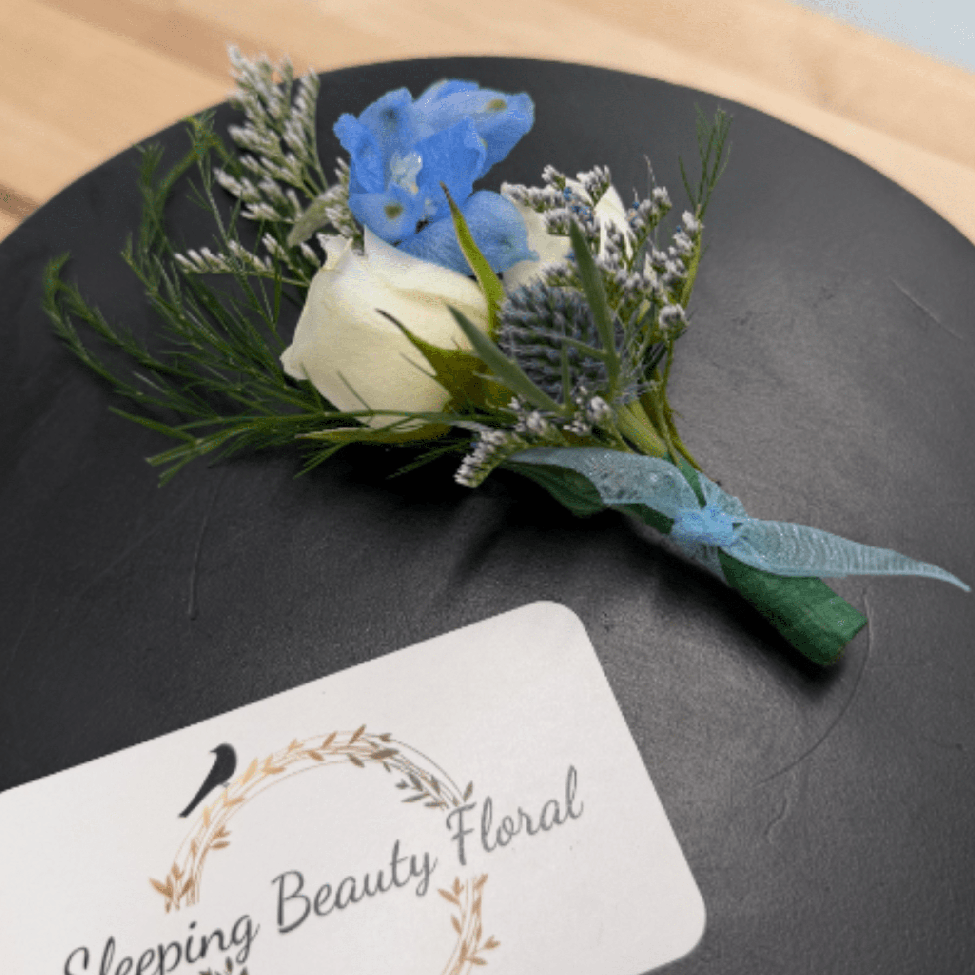A classic red rose boutonni&egrave;re that compliments any suit. Perfect for prom