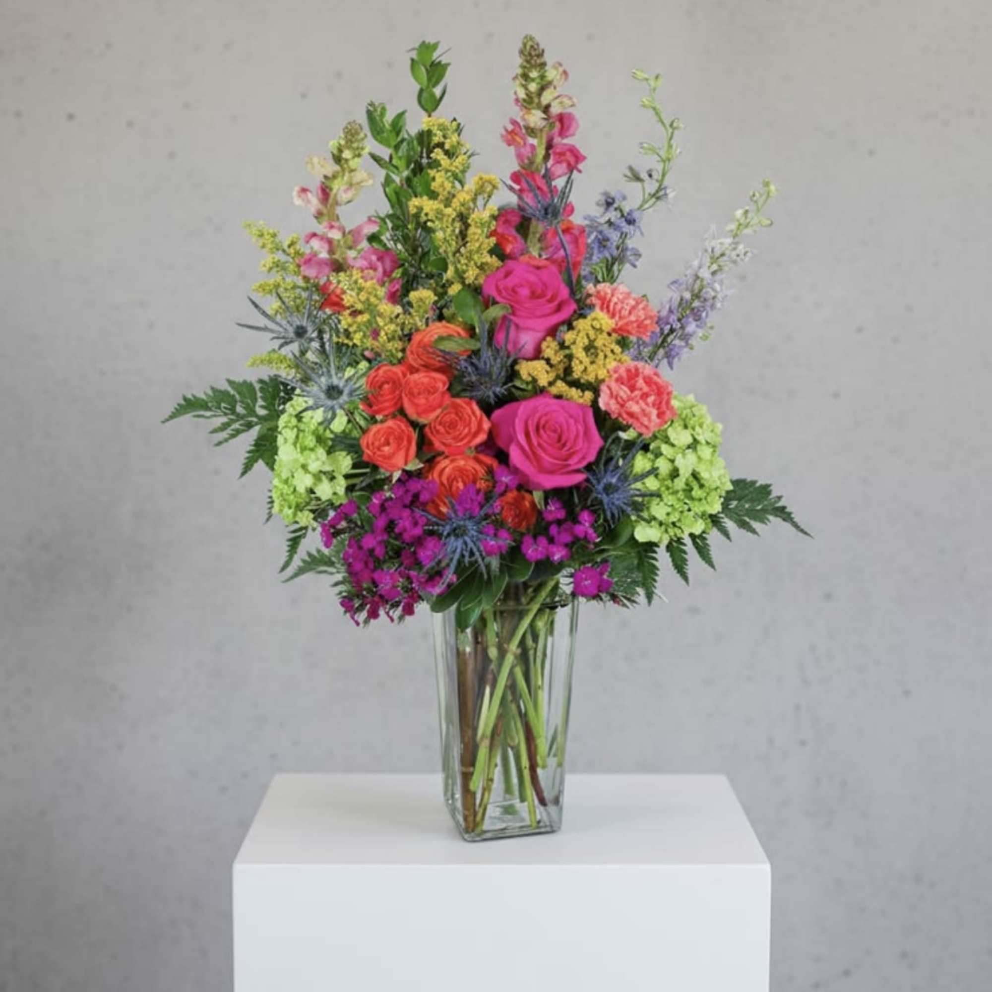 Bright, garden-fresh color greets the eye in this Sweet sunrise flower arrangement