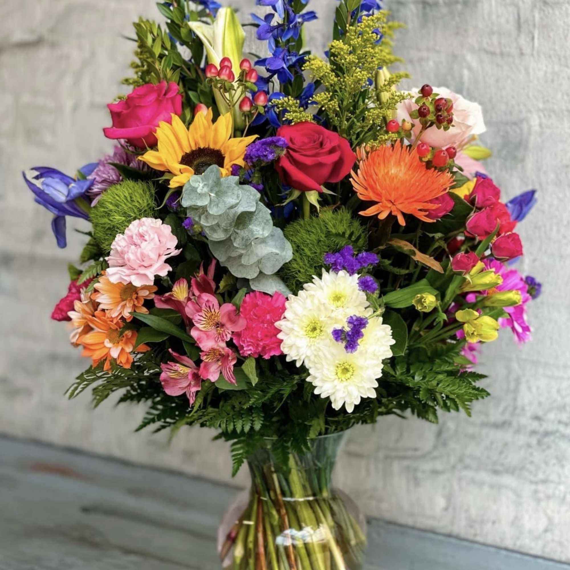 Bright, garden-fresh color greets the eye in this Sweet sunrise flower arrangement