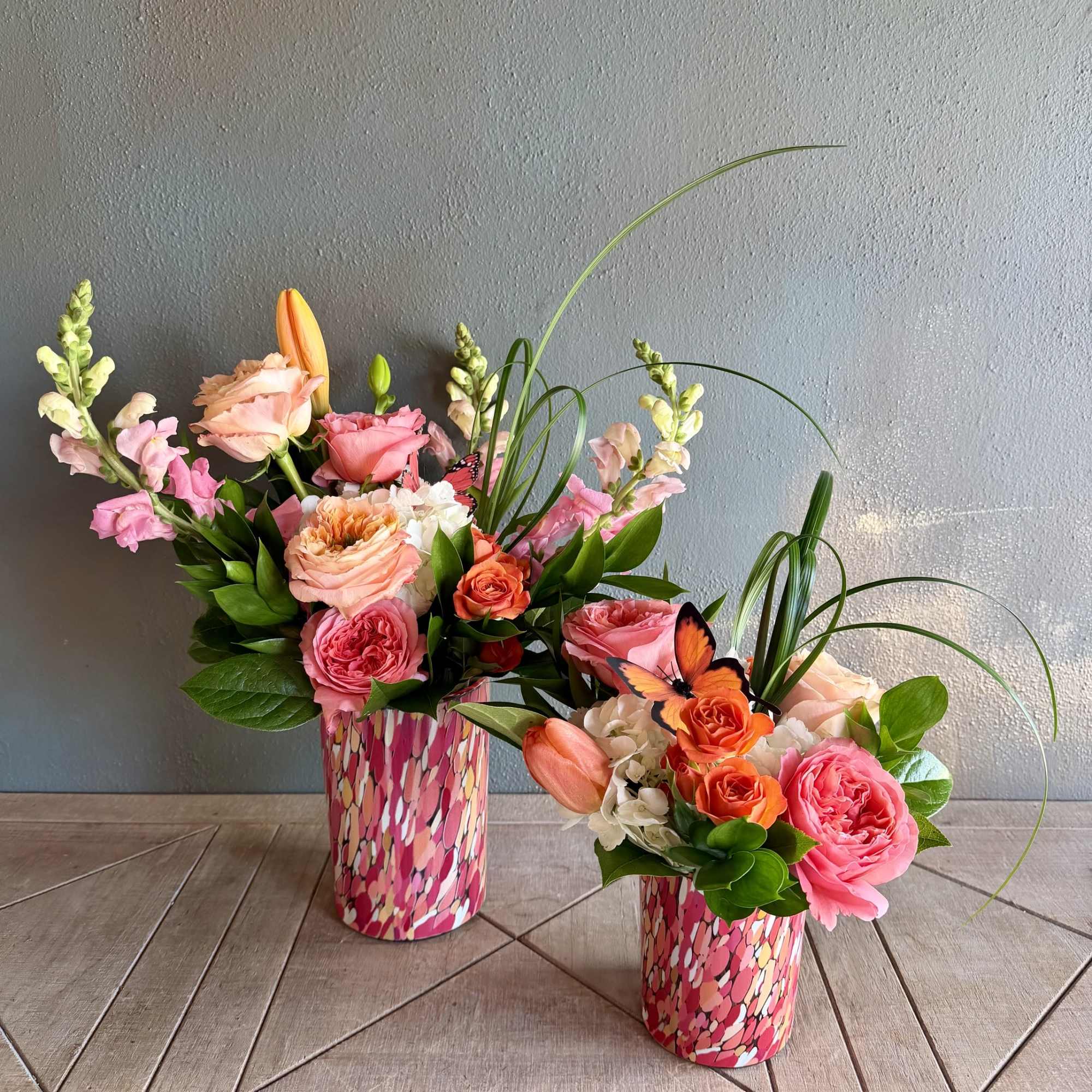 Coral Charms' lively, feminine palette (pink, orange, peach, white, and green) and