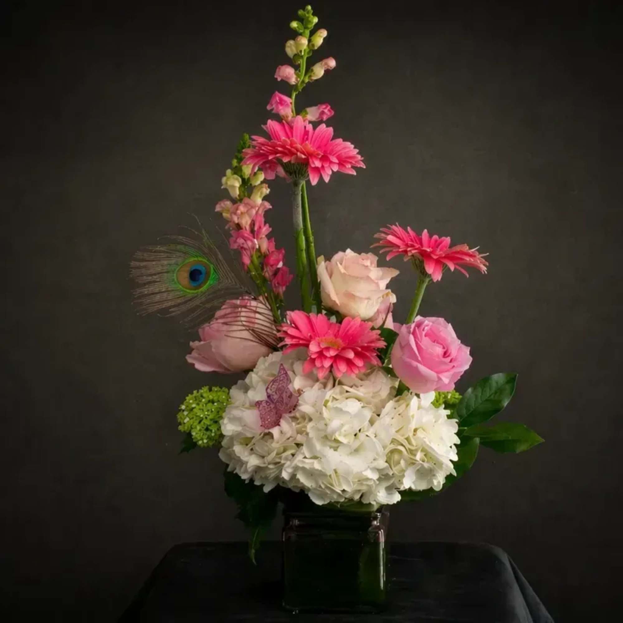 Soft and elegant design featuring a modern asymmetrical silhouette with delicate height