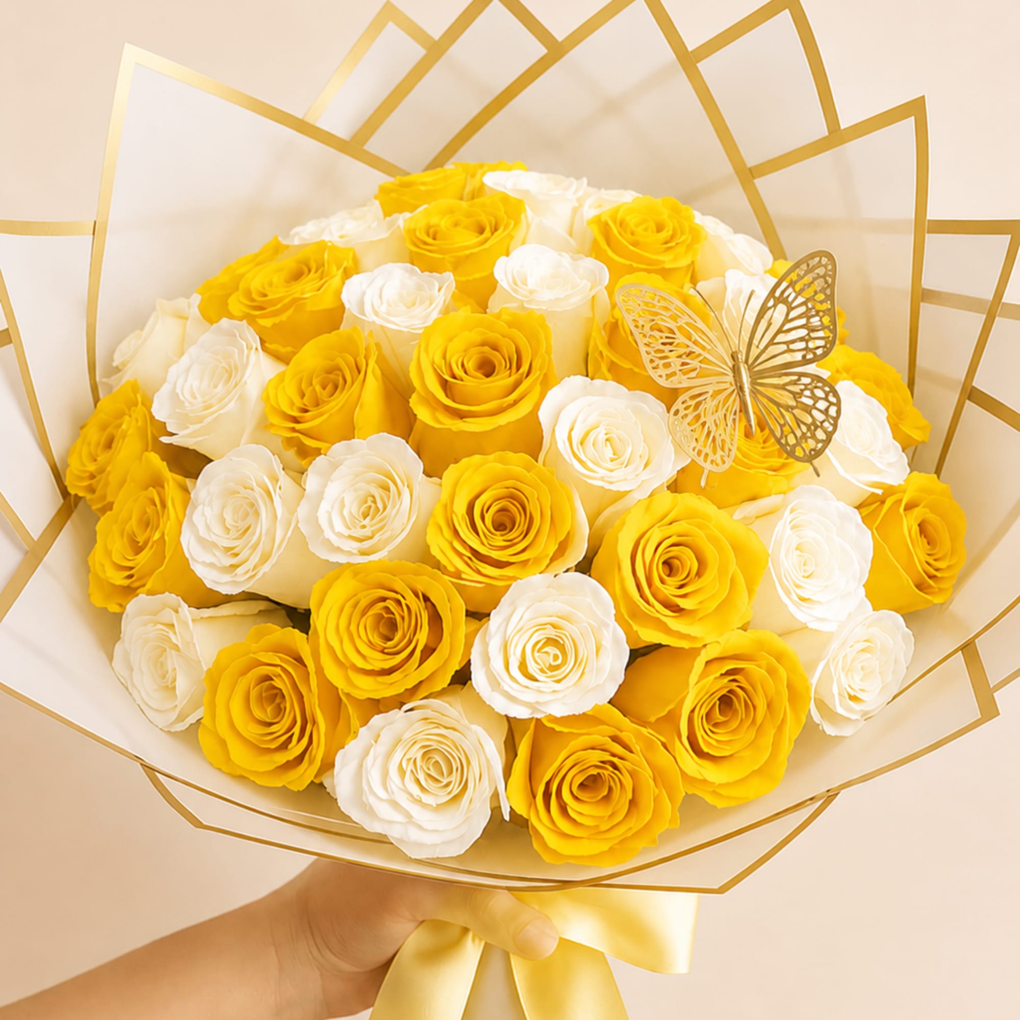 Sunlit yellow and crisp white roses form a sunny, dome-shaped bouquet that