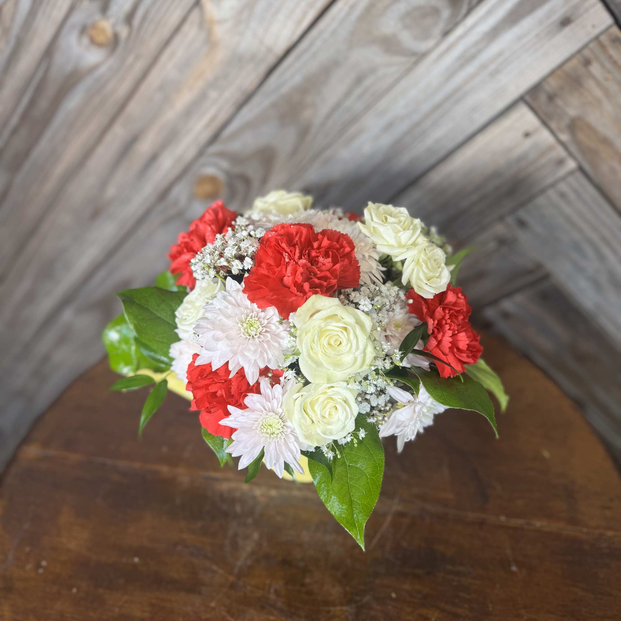 A sweet little watering can filled with love  Designed with fresh