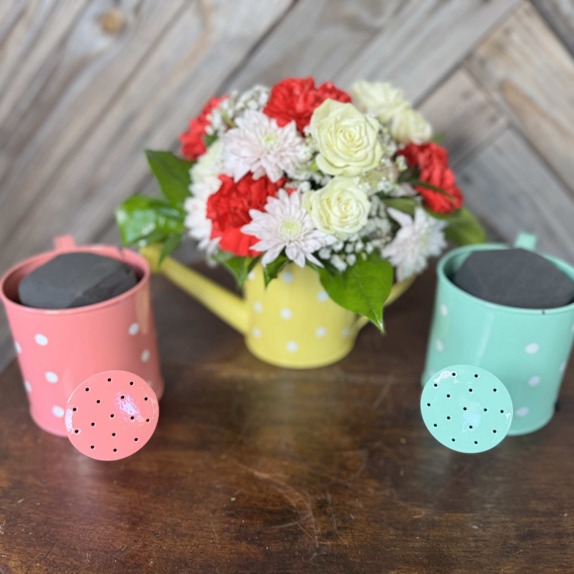A sweet little watering can filled with love  Designed with fresh