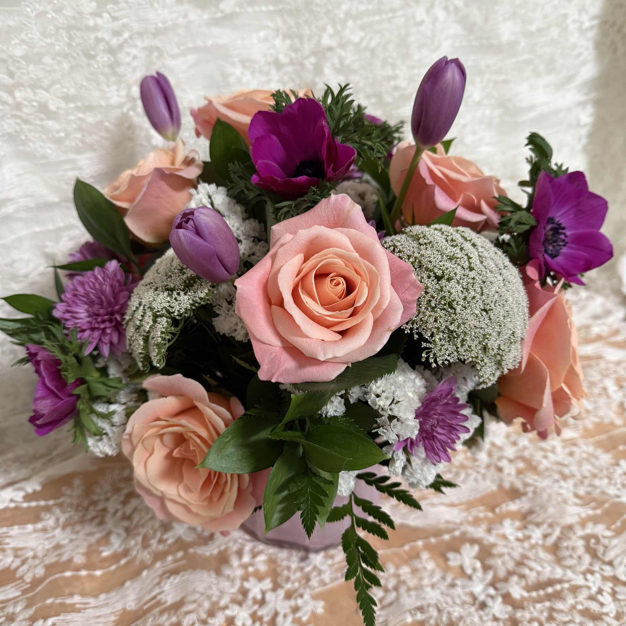 Florist will create a beautiful arrangement with pink and purple flowers in