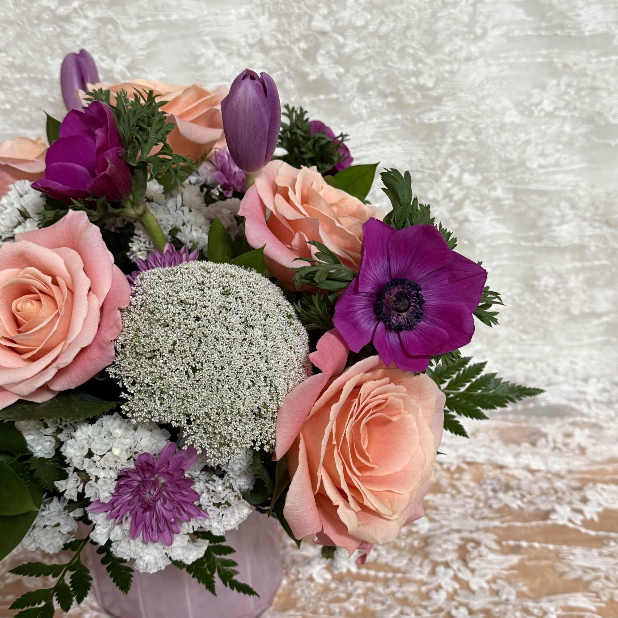 Florist will create a beautiful arrangement with pink and purple flowers in