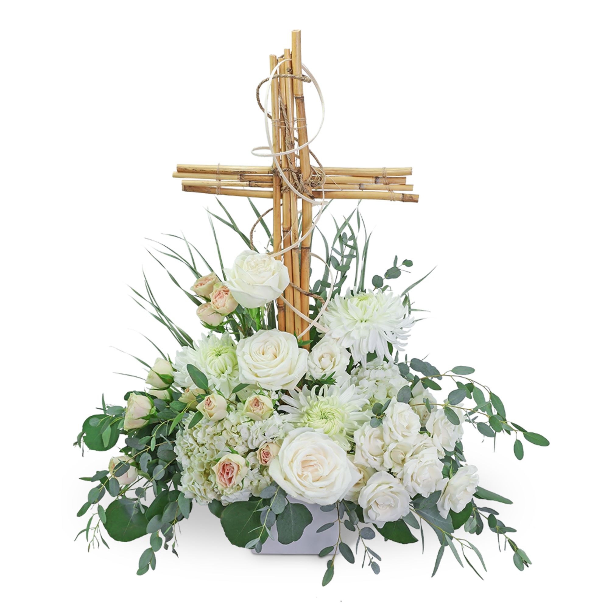 White floral arrangement with a wooden cross centerpiece