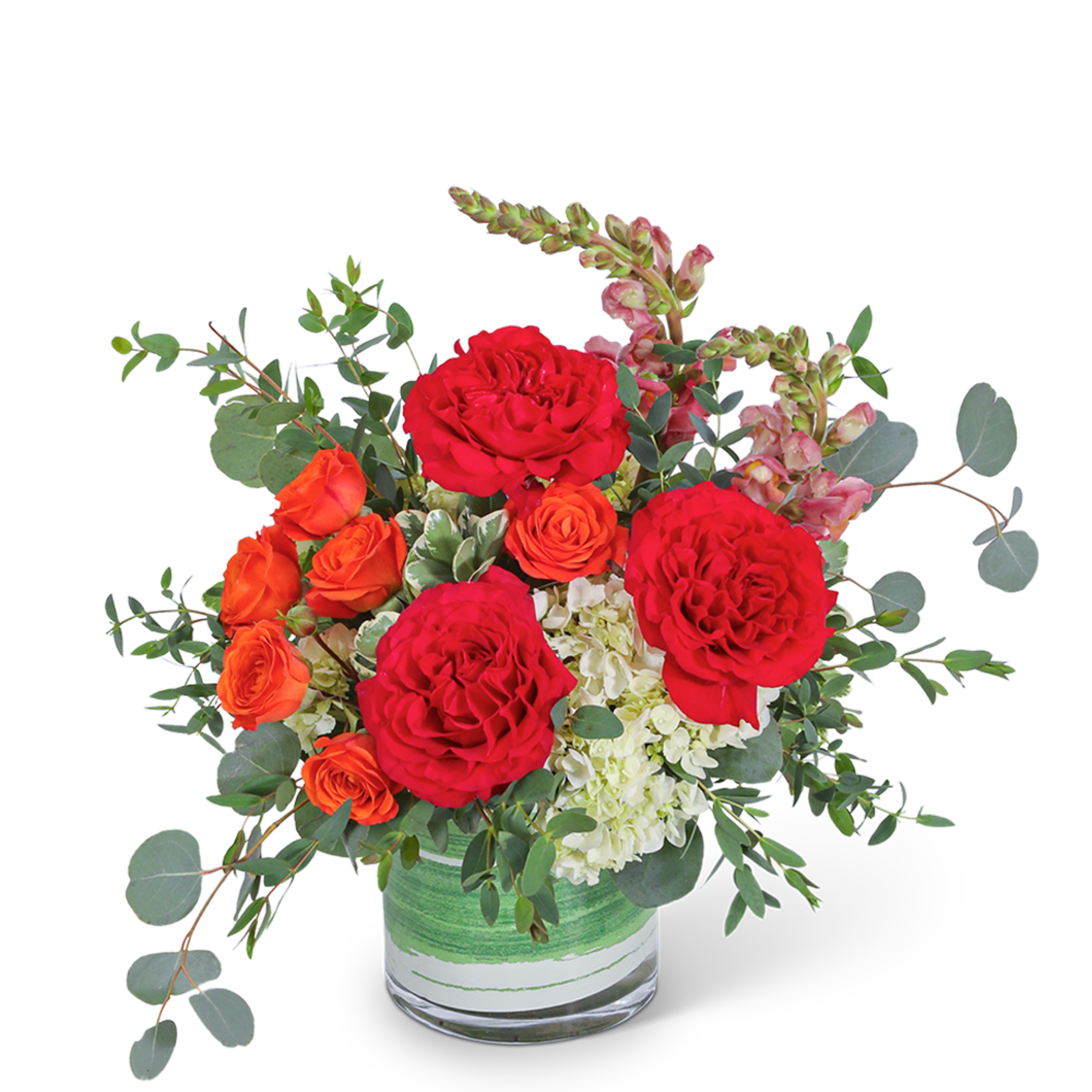 Red and orange roses in a glass vase with white hydrangea and eucalyptus