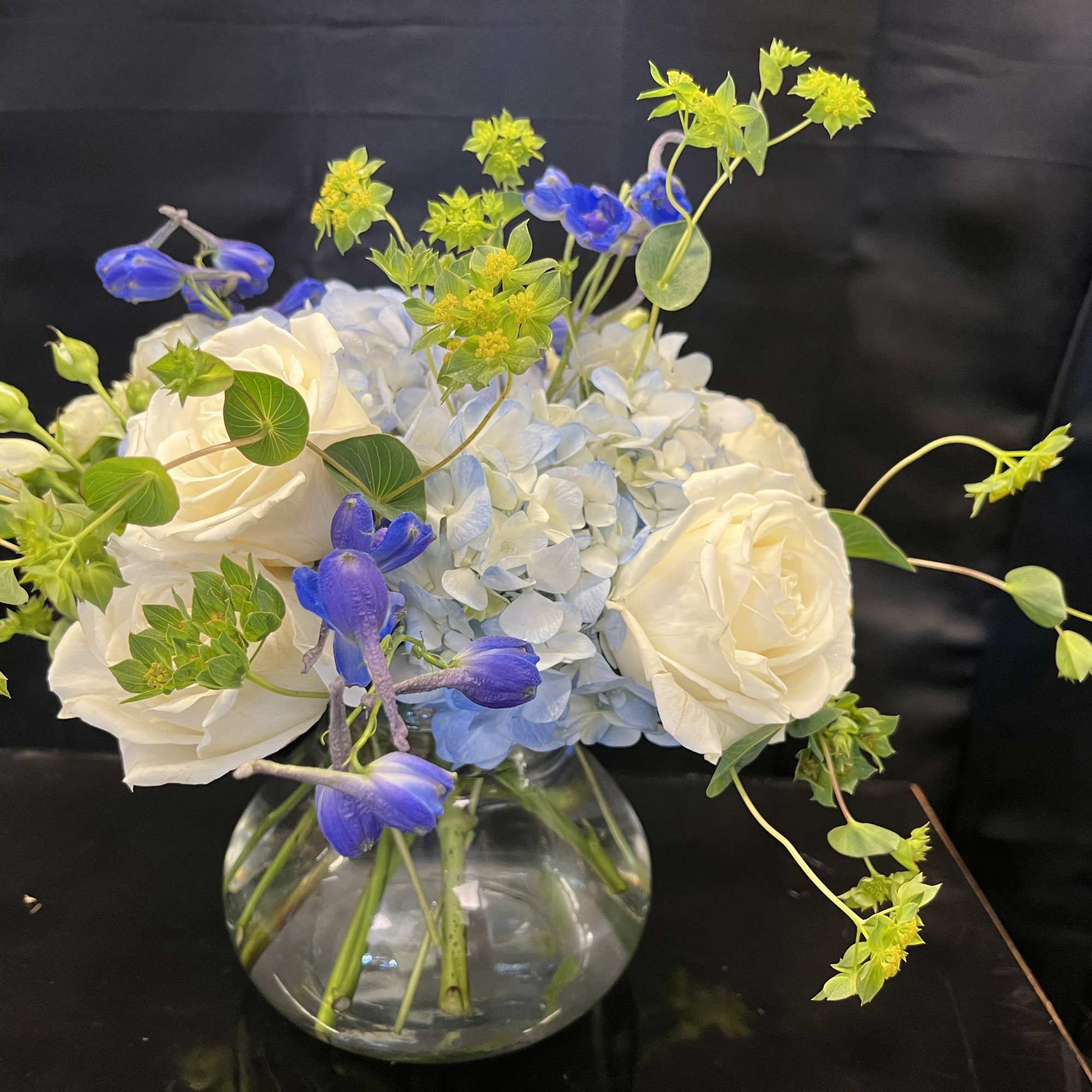 A simple, yet sophisticated arrangement with white and blue colors. Order for
