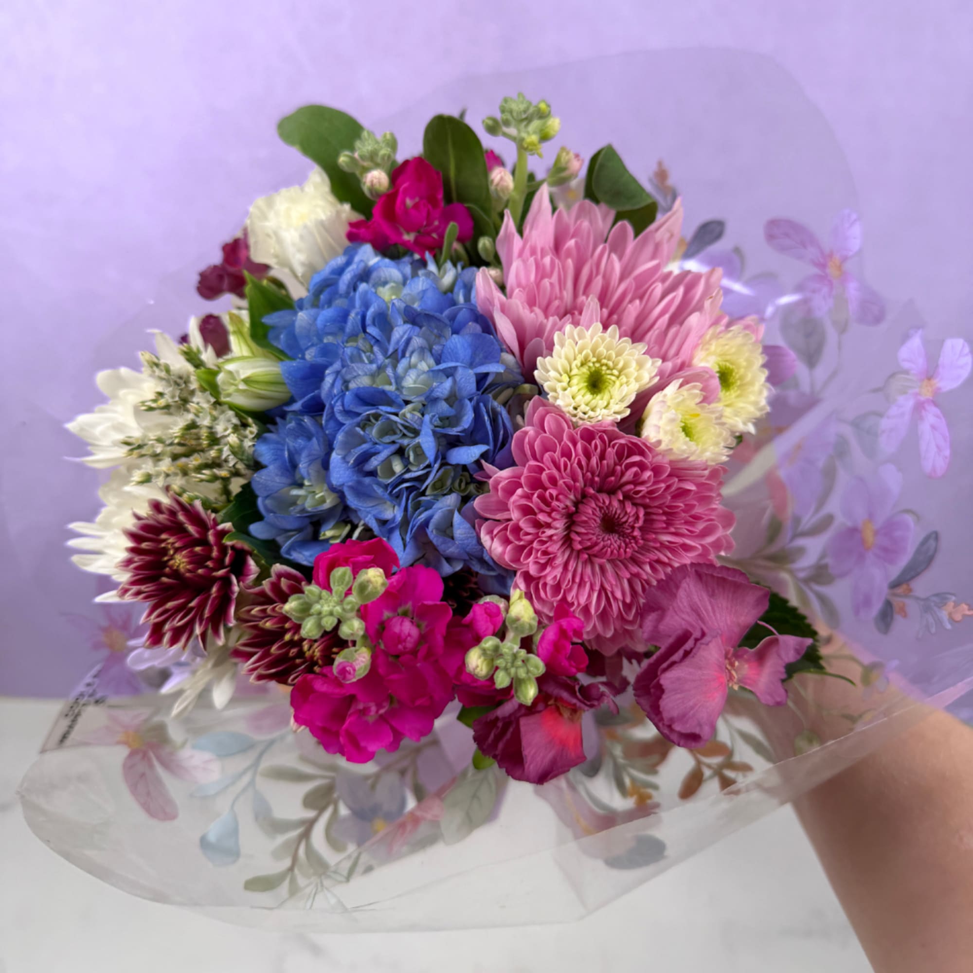 Our Cool &amp; Serene Wrapped Bouquet features a calming blend of soft