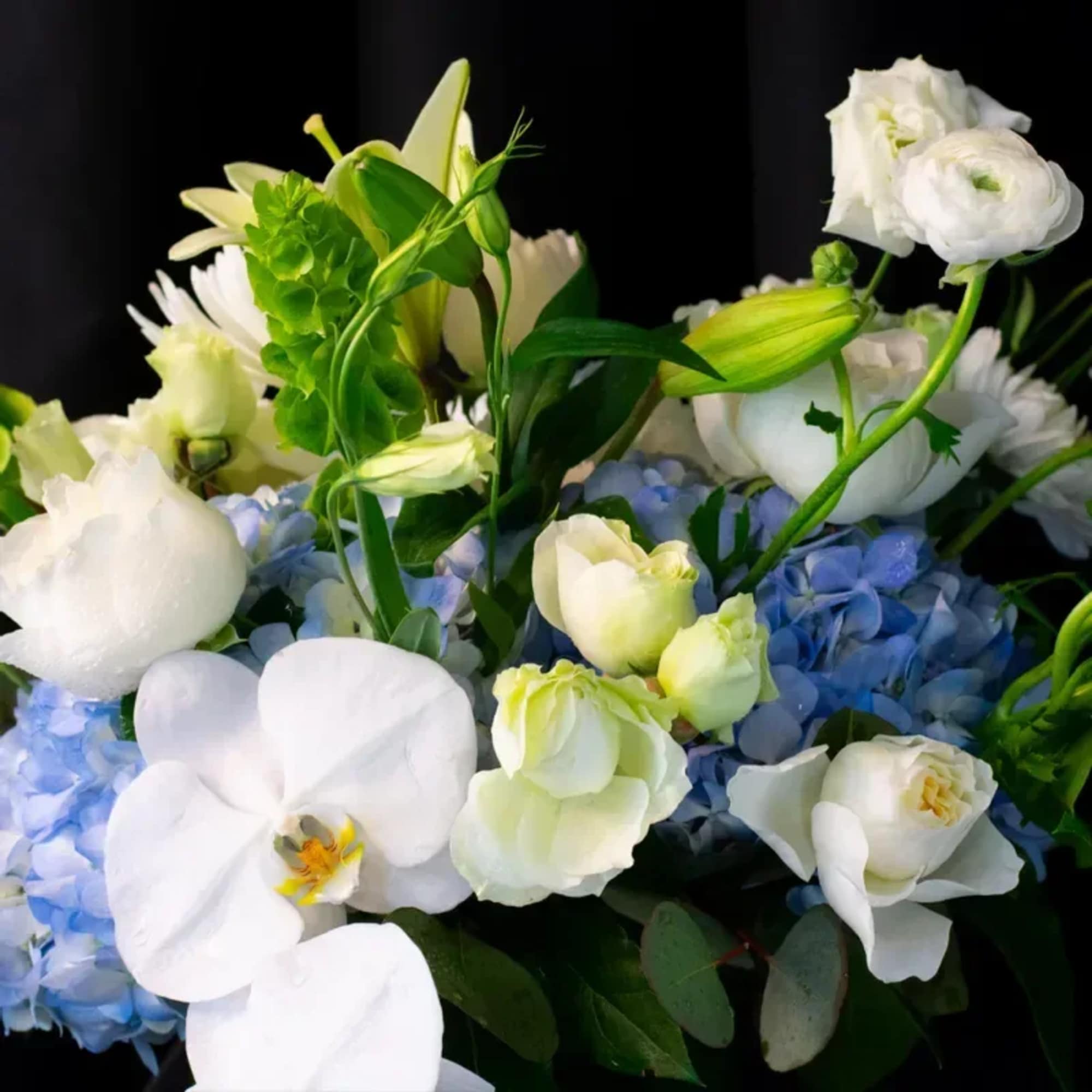 A serene arrangement perfect for any and all occasions. Bursting with a