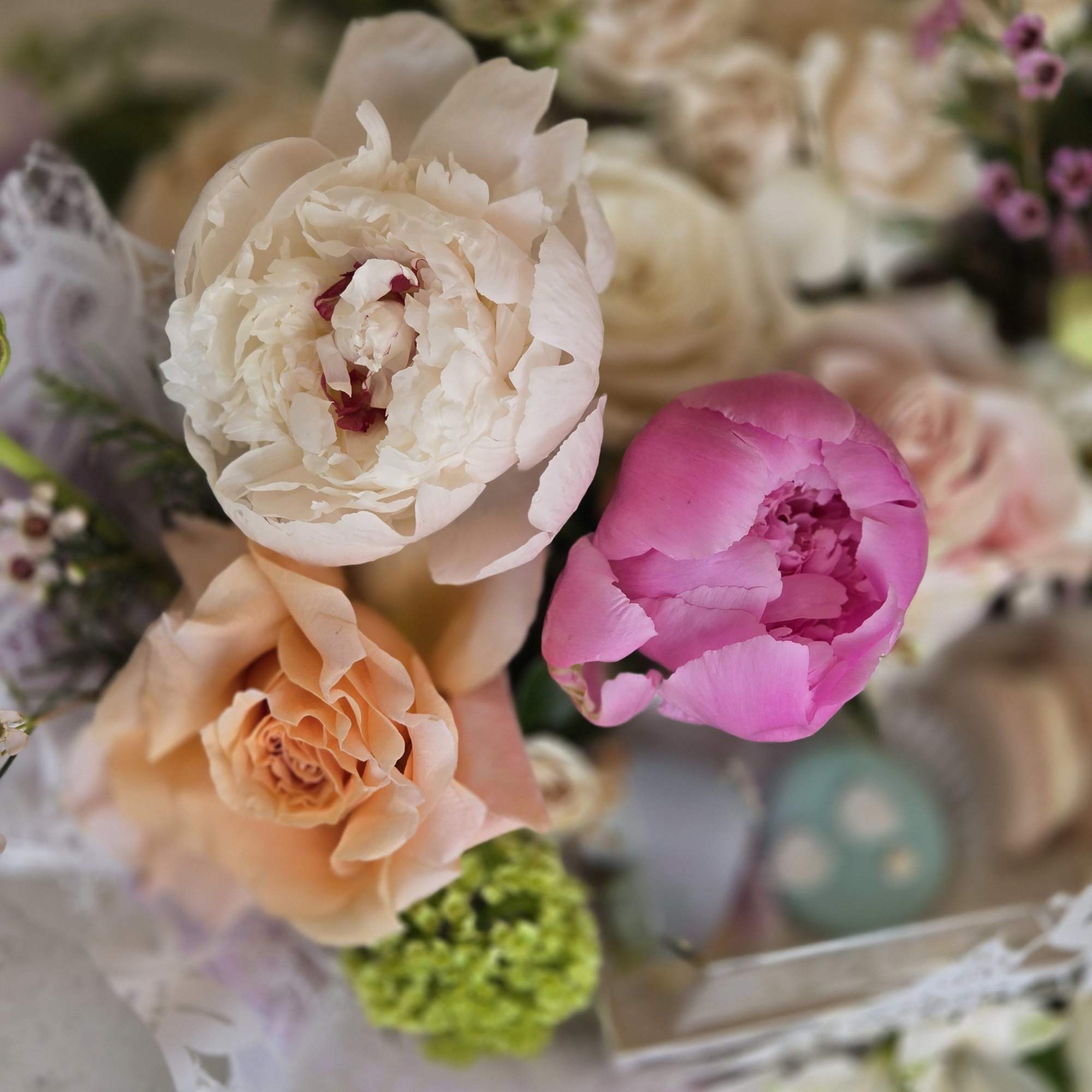 A special Mother&rsquo;s Day flower basket paired with delicate macarons, creating a