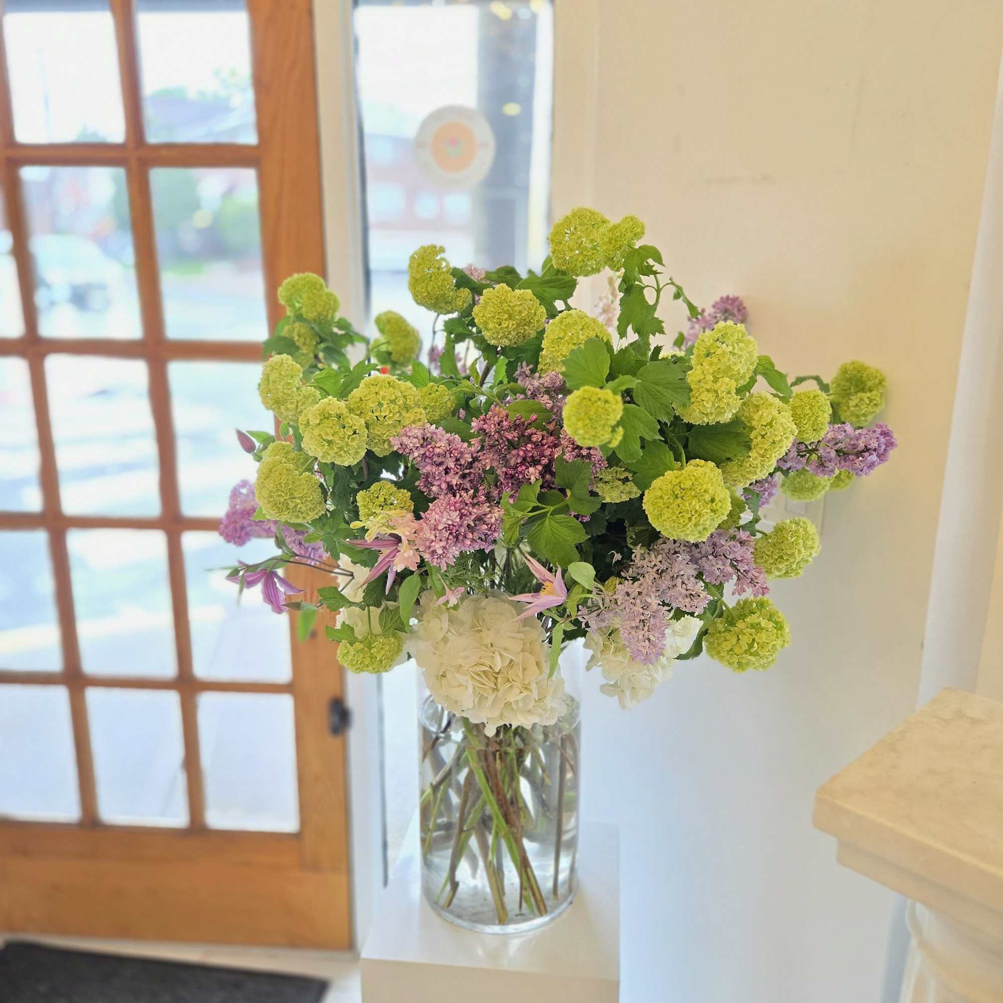 A tall and large Designer&rsquo;s Choice arrangement, crafted with the finest seasonal