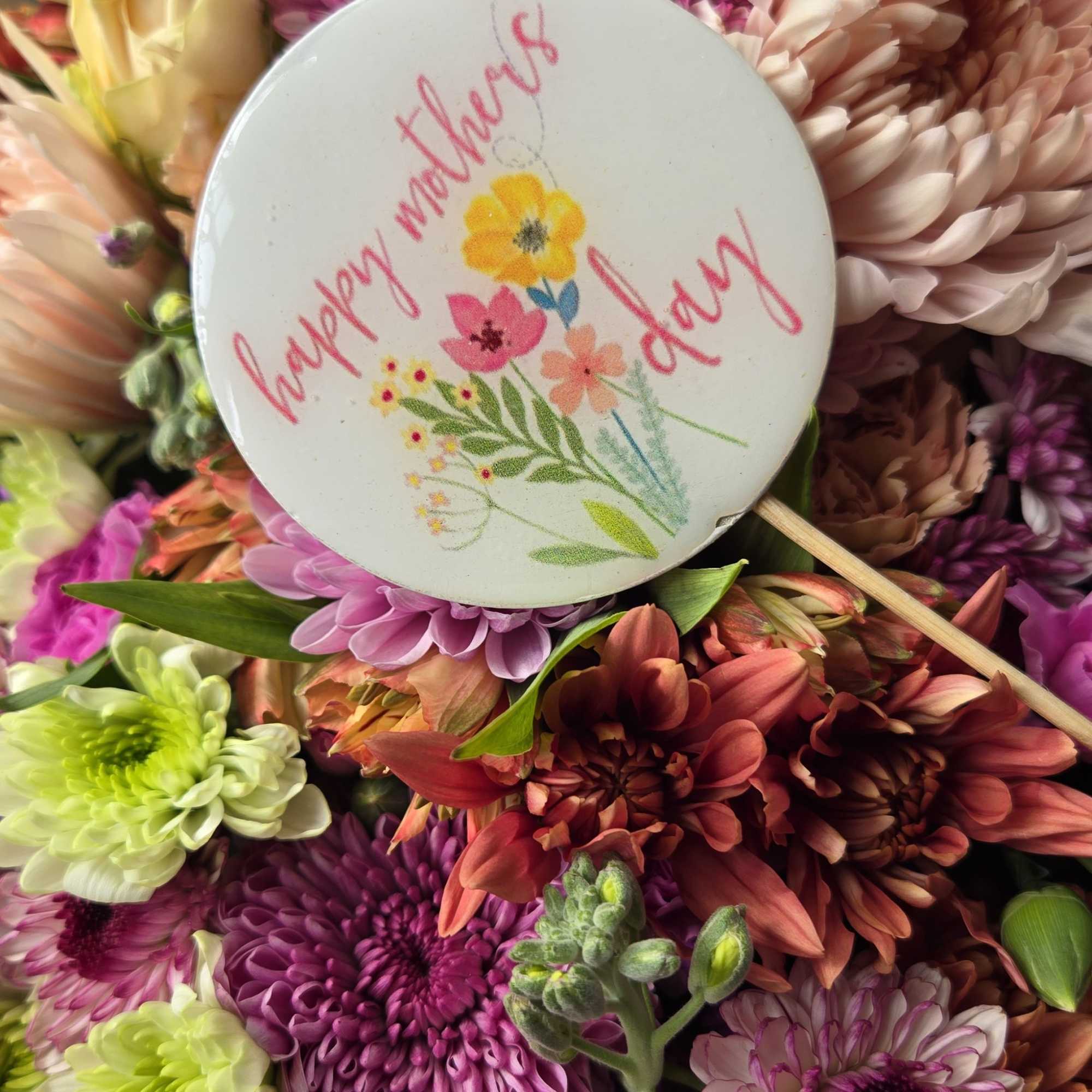Lavender and soft purple chrysanthemums lead a lush, close-packed bouquet that feels