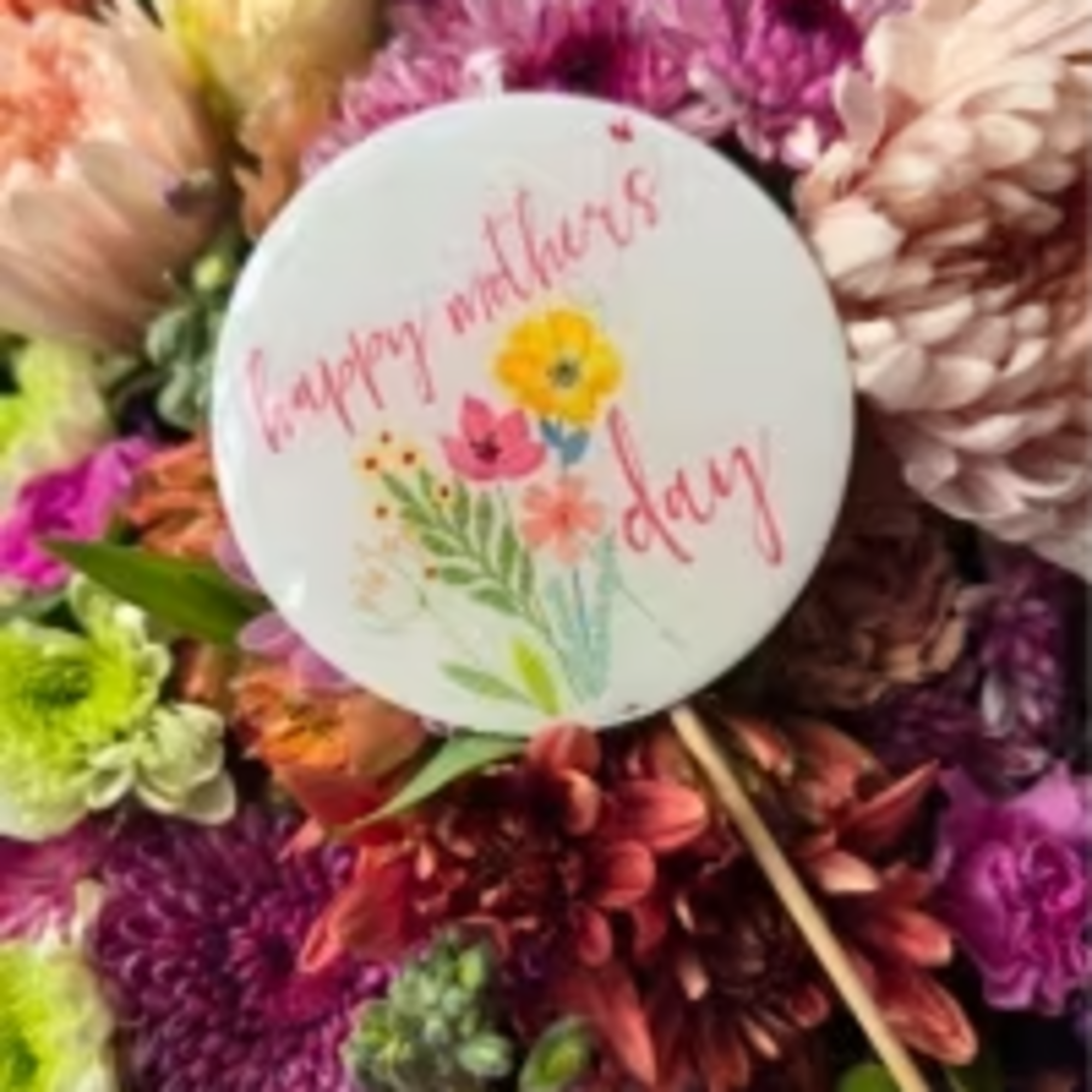 Lavender and soft purple chrysanthemums lead a lush, close-packed bouquet that feels
