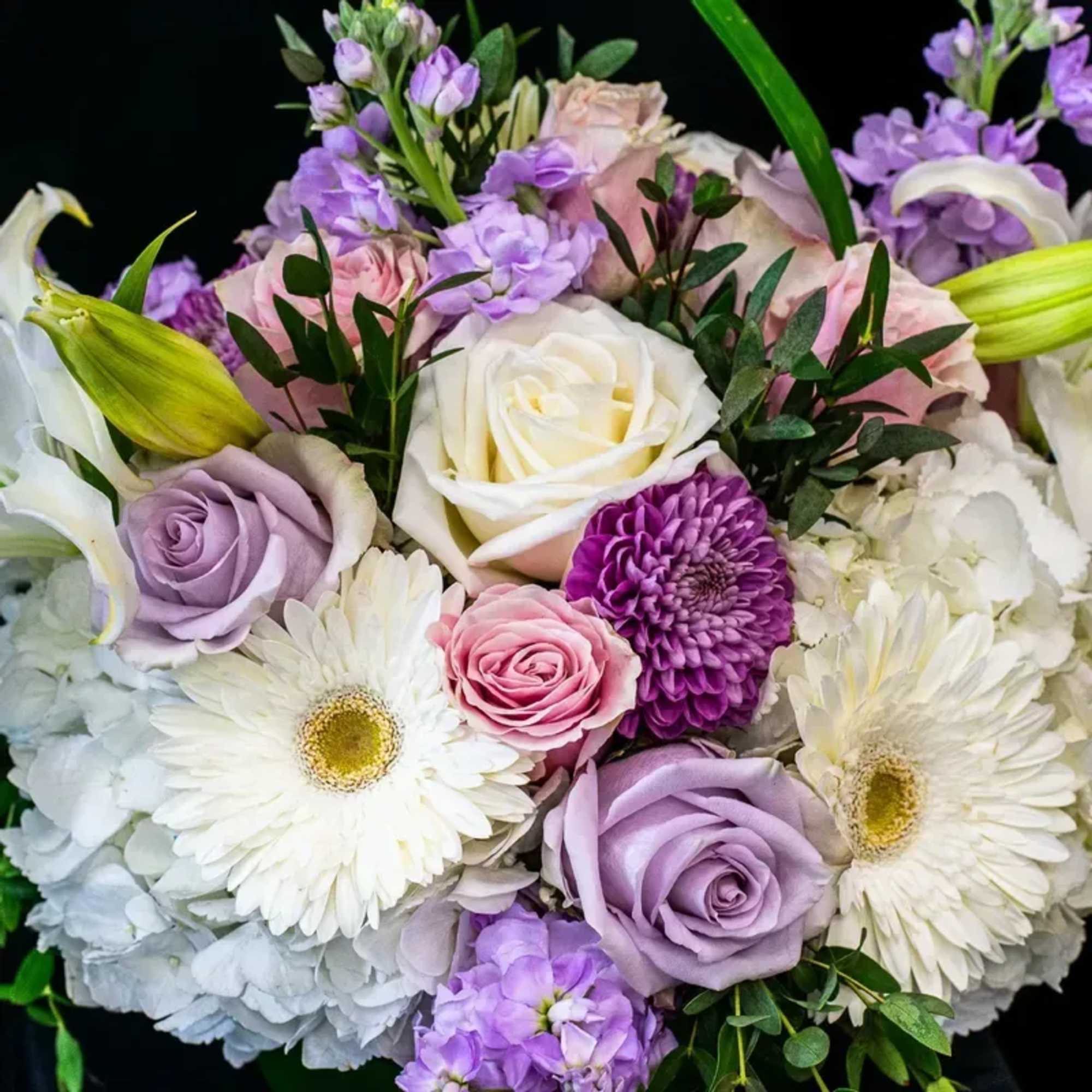 Soft and pale pinks, lavanders with whites are showcased in this 8'