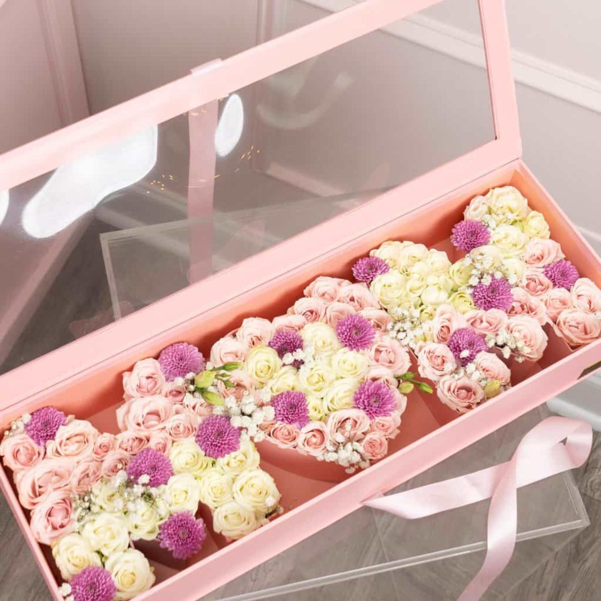 Beautiful flower box with roses 