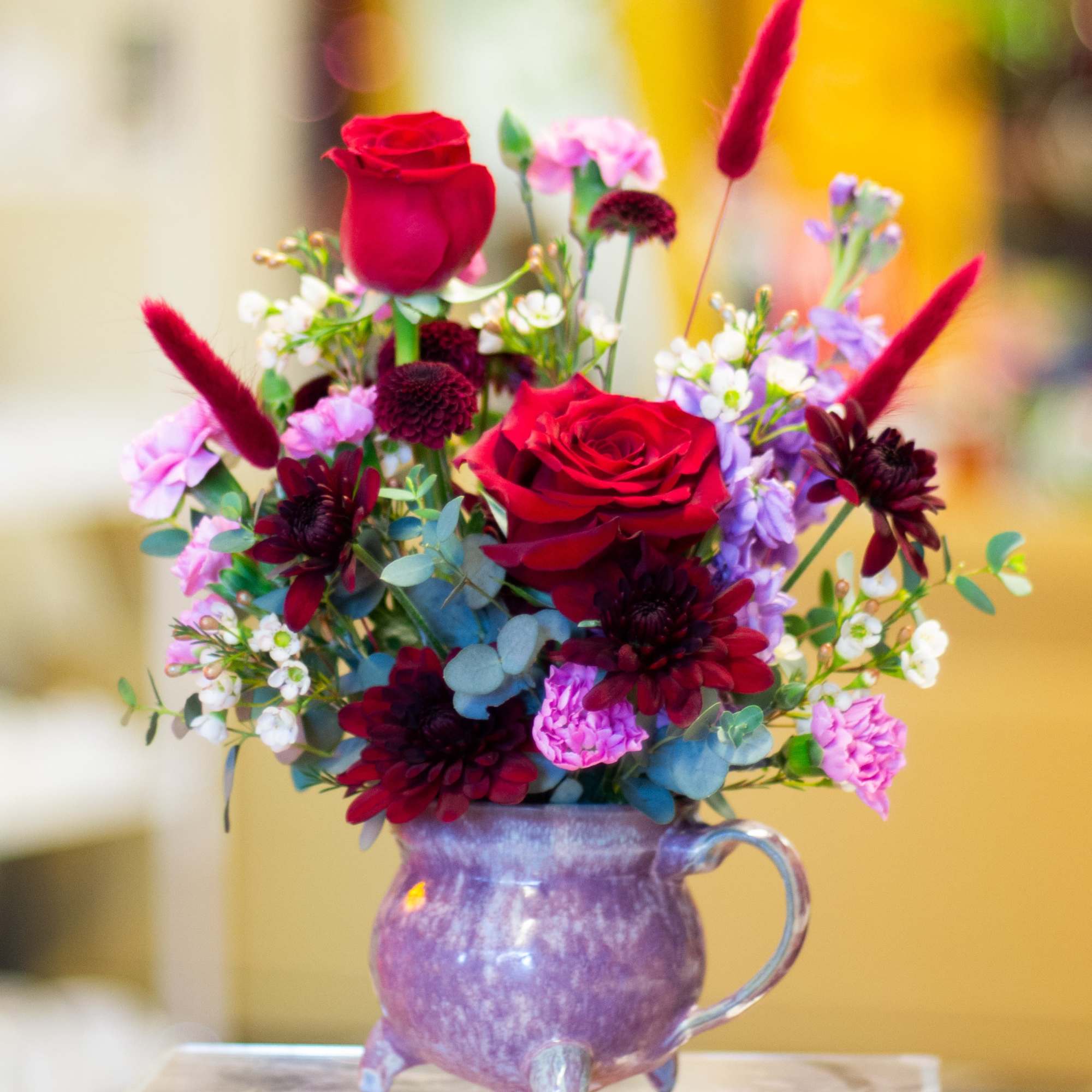 The design, flowers, and mug used for this arrangement are left in