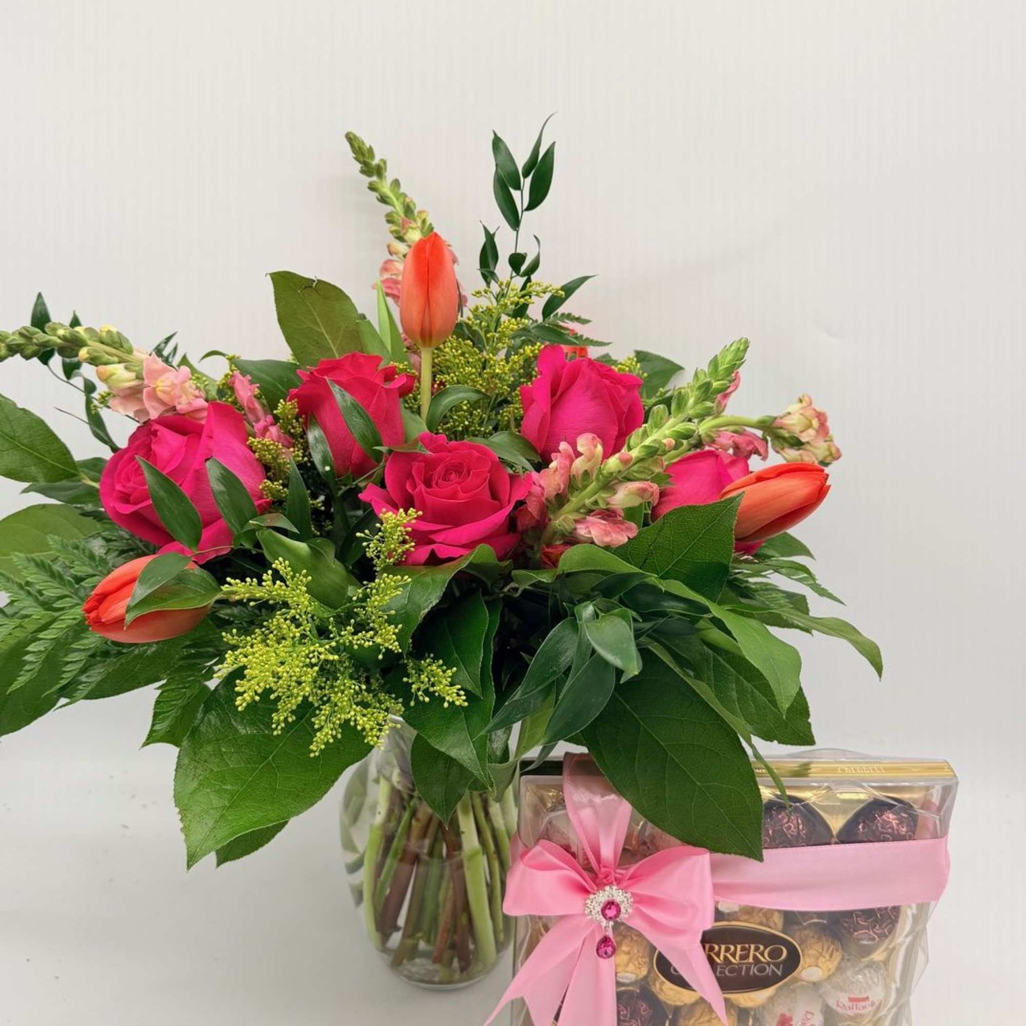 A sweet and stylish mix of roses, tulips, and fresh seasonal blooms.
