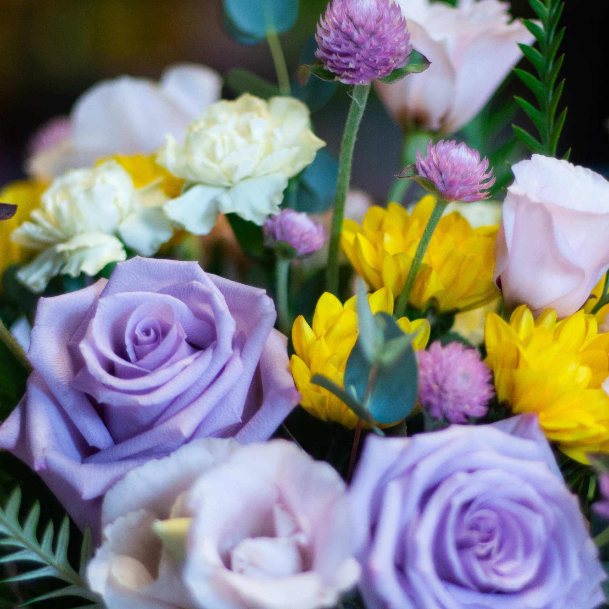 The design, flowers, and vessel used for this mini arrangement are left