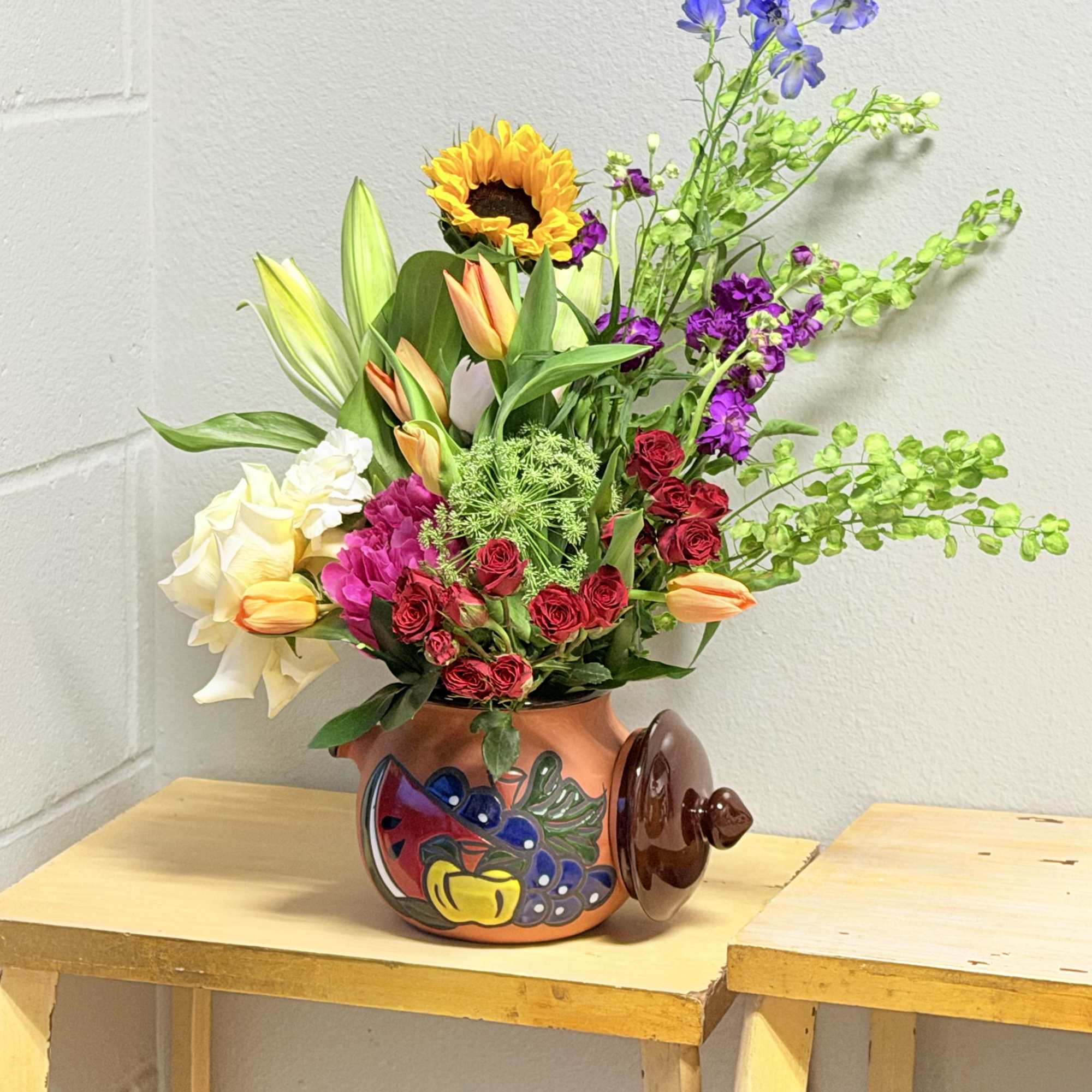 A bright, joyful centerpiece that reads like a sunlit garden-this flower arrangement