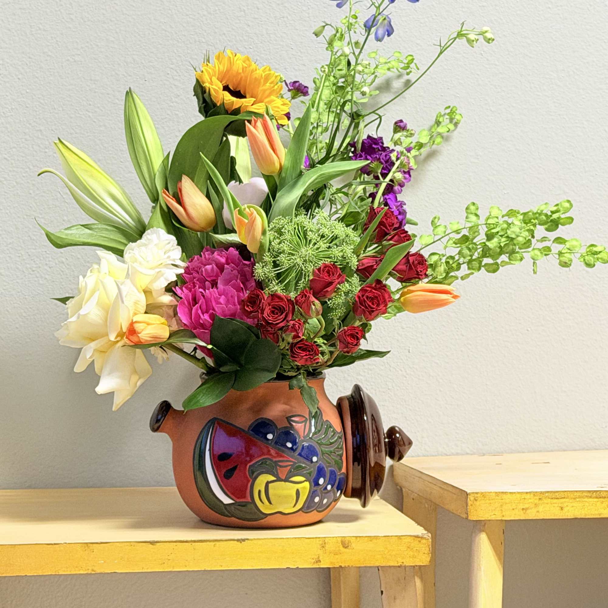 A bright, joyful centerpiece that reads like a sunlit garden-this flower arrangement