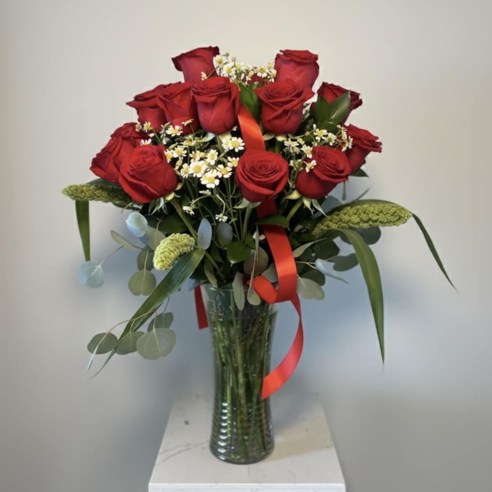 Capture the essence of thoughtful elegance with this premium floral arrangement, designed