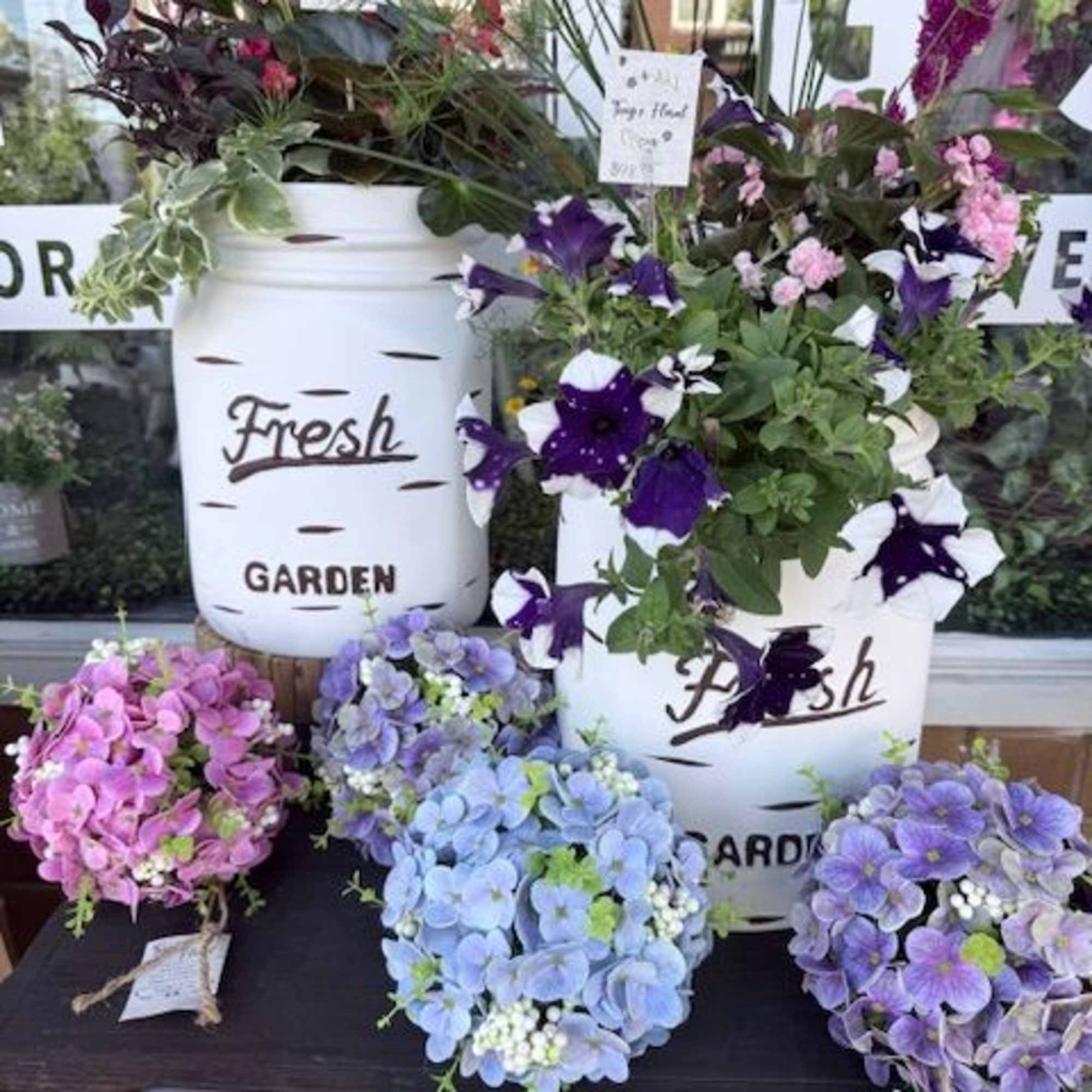 A cheerful, garden-fresh arrangement in a mason jar planter that feels like