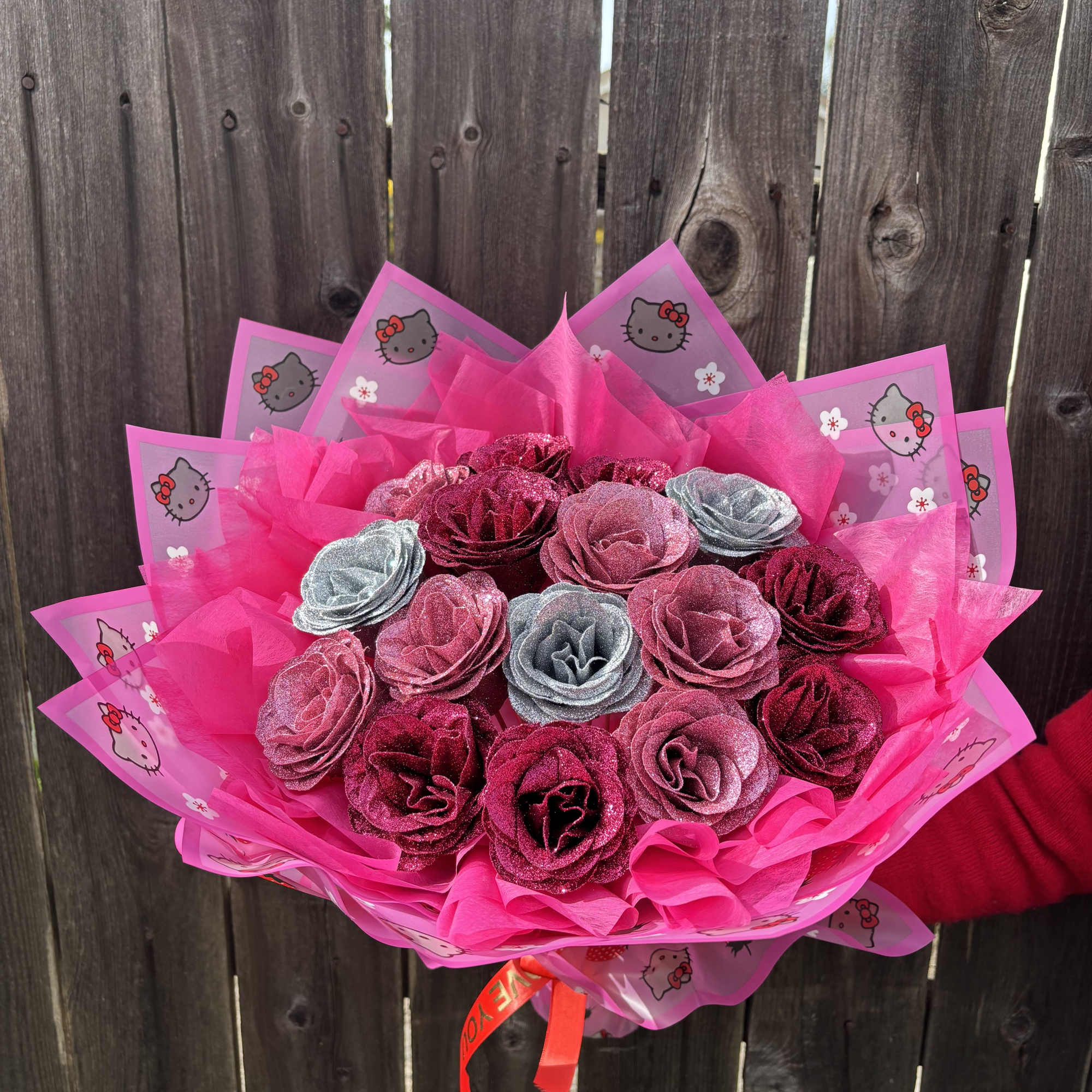Pink bouquet of glittery roses wrapped in Hello Kitty paper