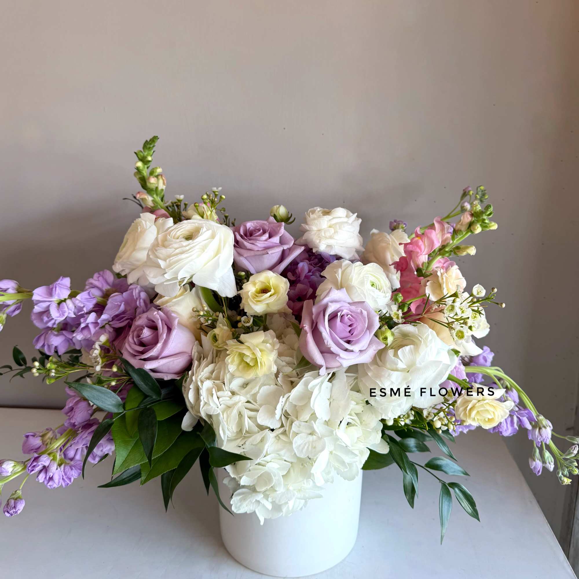 A serene blend of soft lavender and creamy white blooms in a