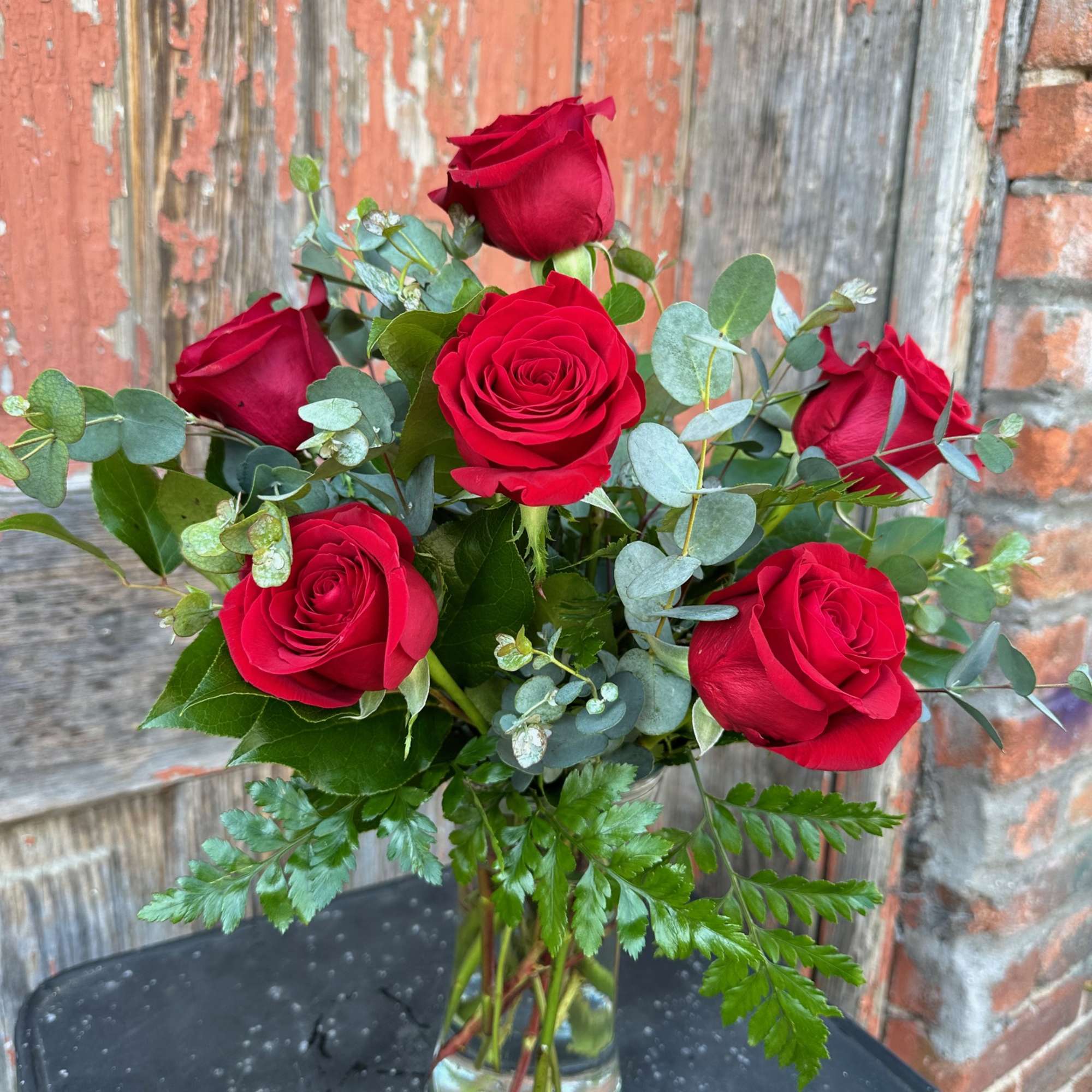 Bouquet of red roses in a clear glass vase