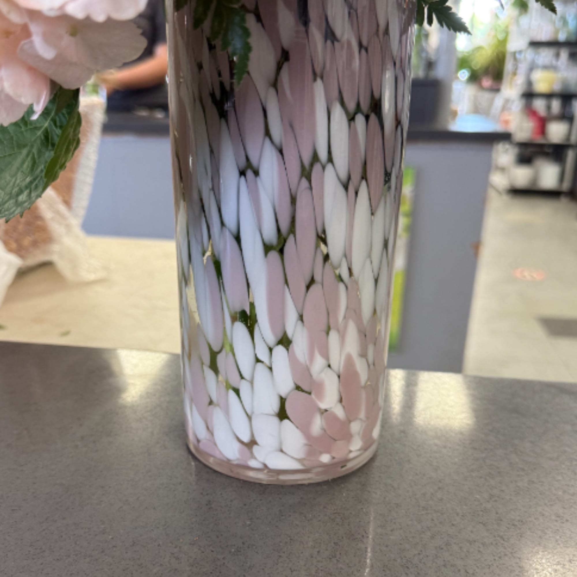 Soft pink roses and blushing hydrangeas mingle with pink carnations and delicate
