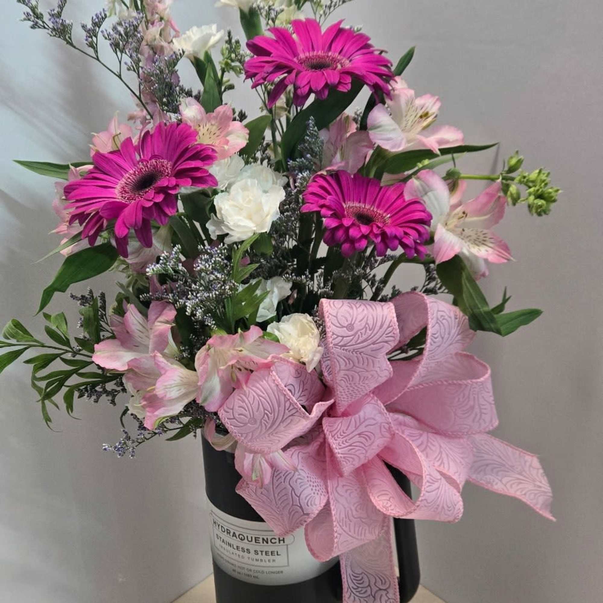Introducing "Blossom Brew" &ndash; a unique floral arrangement presented in a 40oz