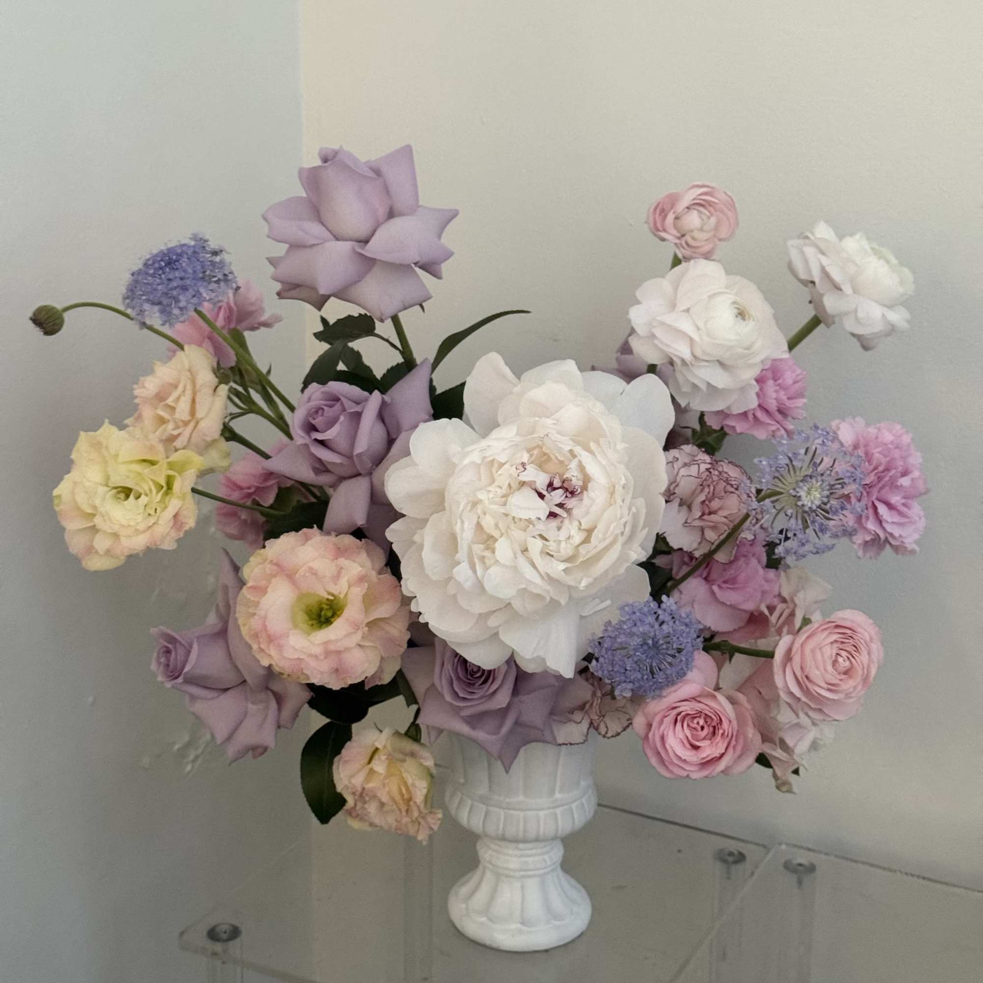 Lavender and blush tones mingle like a spring garden in bloom-this pedestal