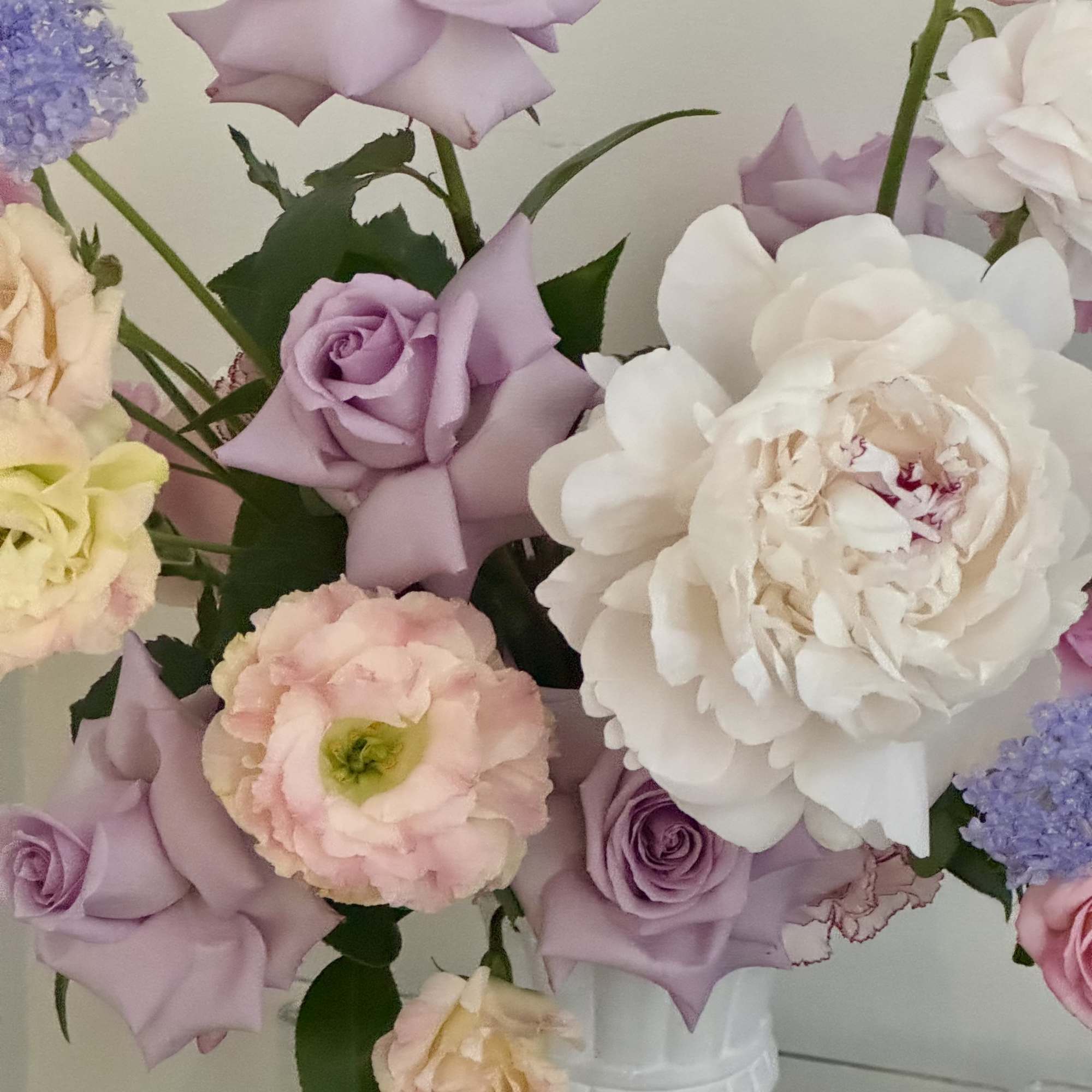 Lavender and blush tones mingle like a spring garden in bloom-this pedestal