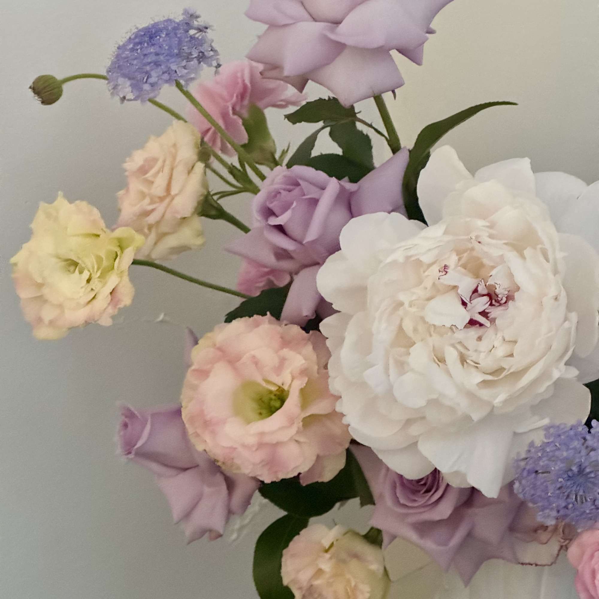 Lavender and blush tones mingle like a spring garden in bloom-this pedestal
