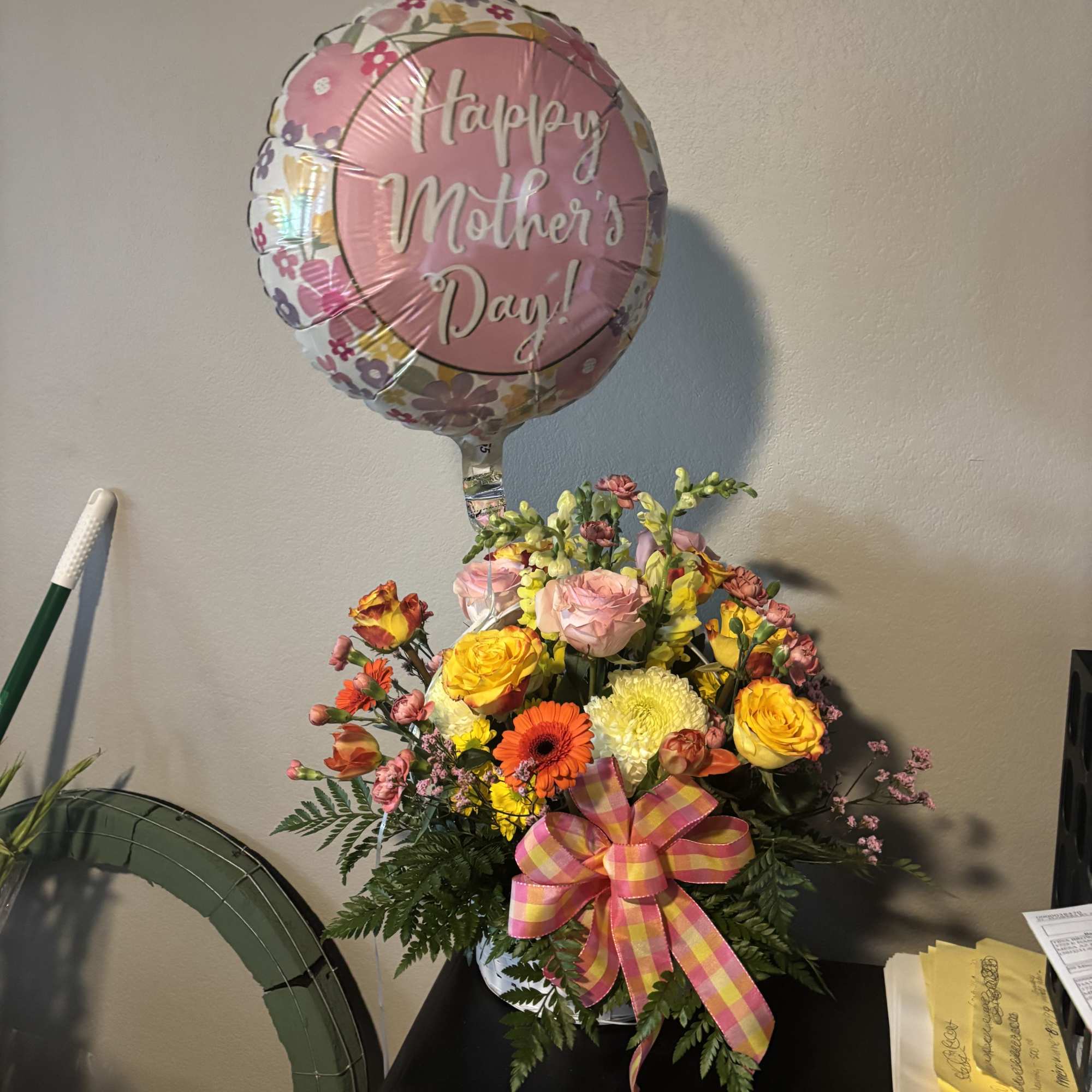 Beautuful basket of mixed roses, tulips, mums, daisys etc. with a pretty