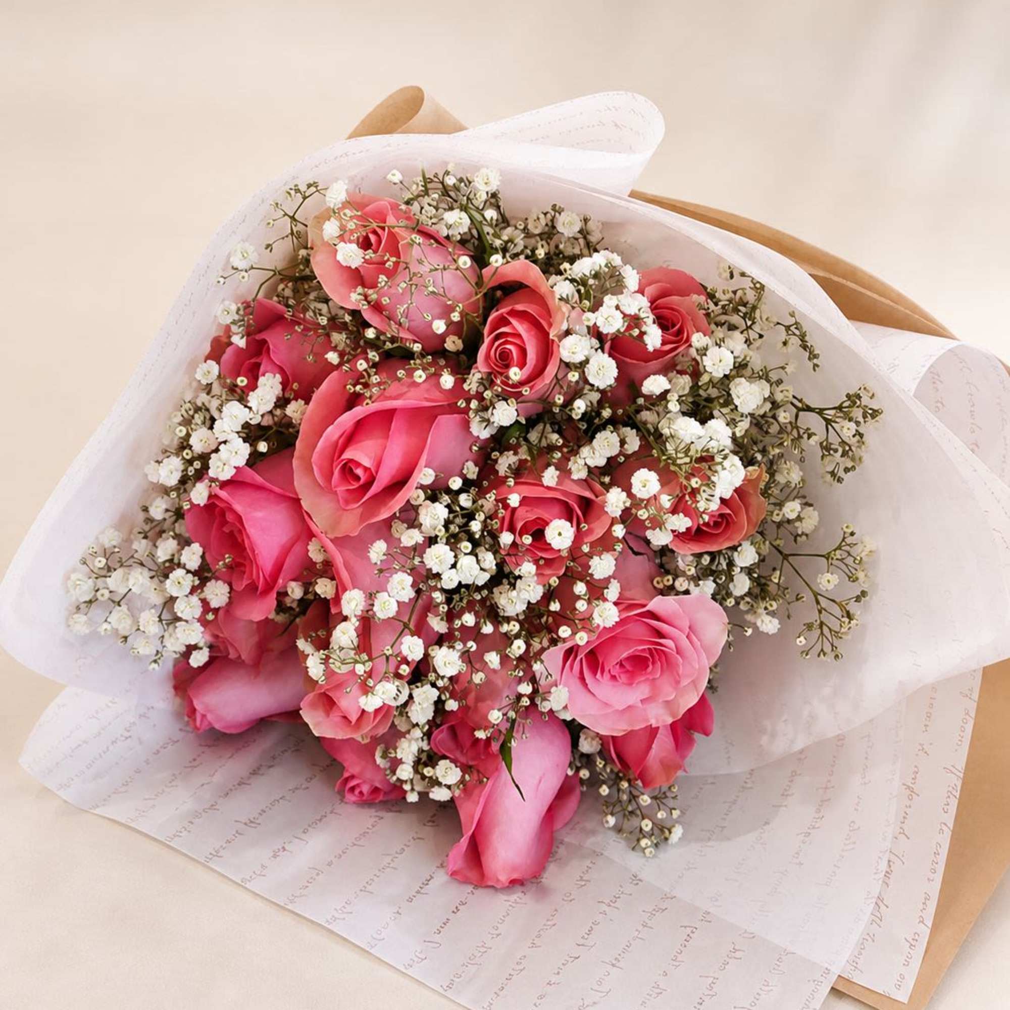 A timeless and romantic bouquet featuring soft pink roses paired with delicate