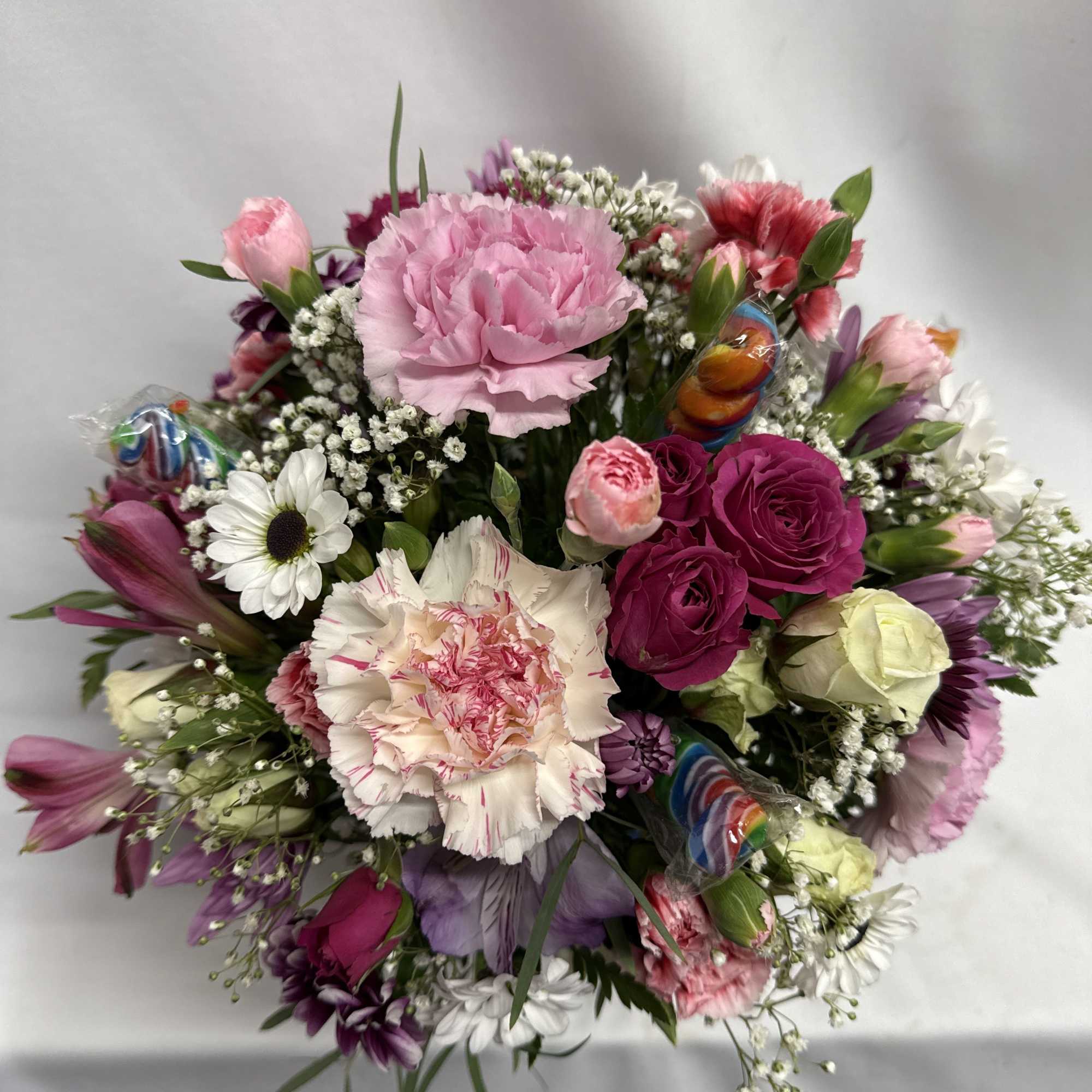 A cheerful mixed-color flower arrangement, making it a joyful choice for a