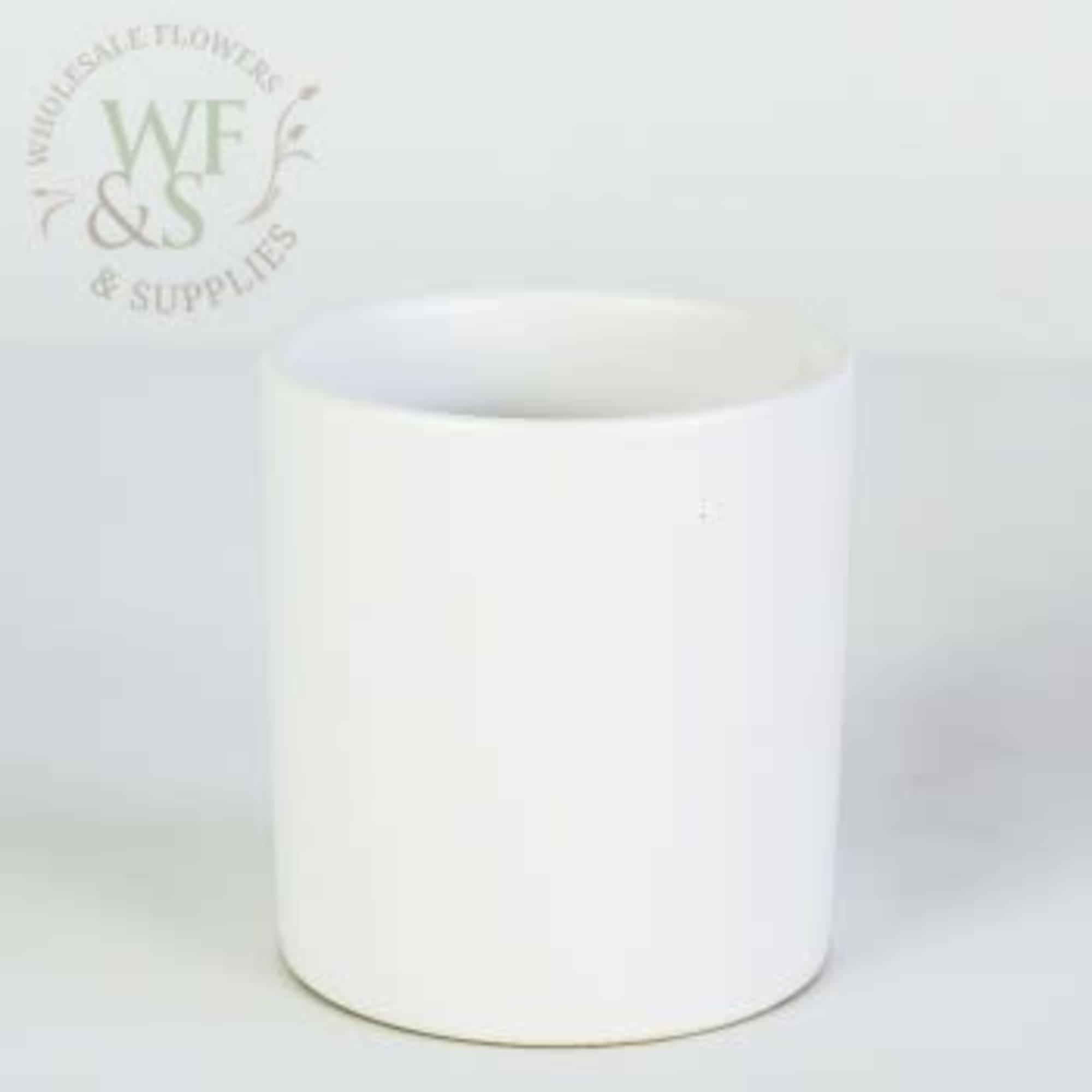 Plain white cylindrical ceramic vase on a light background