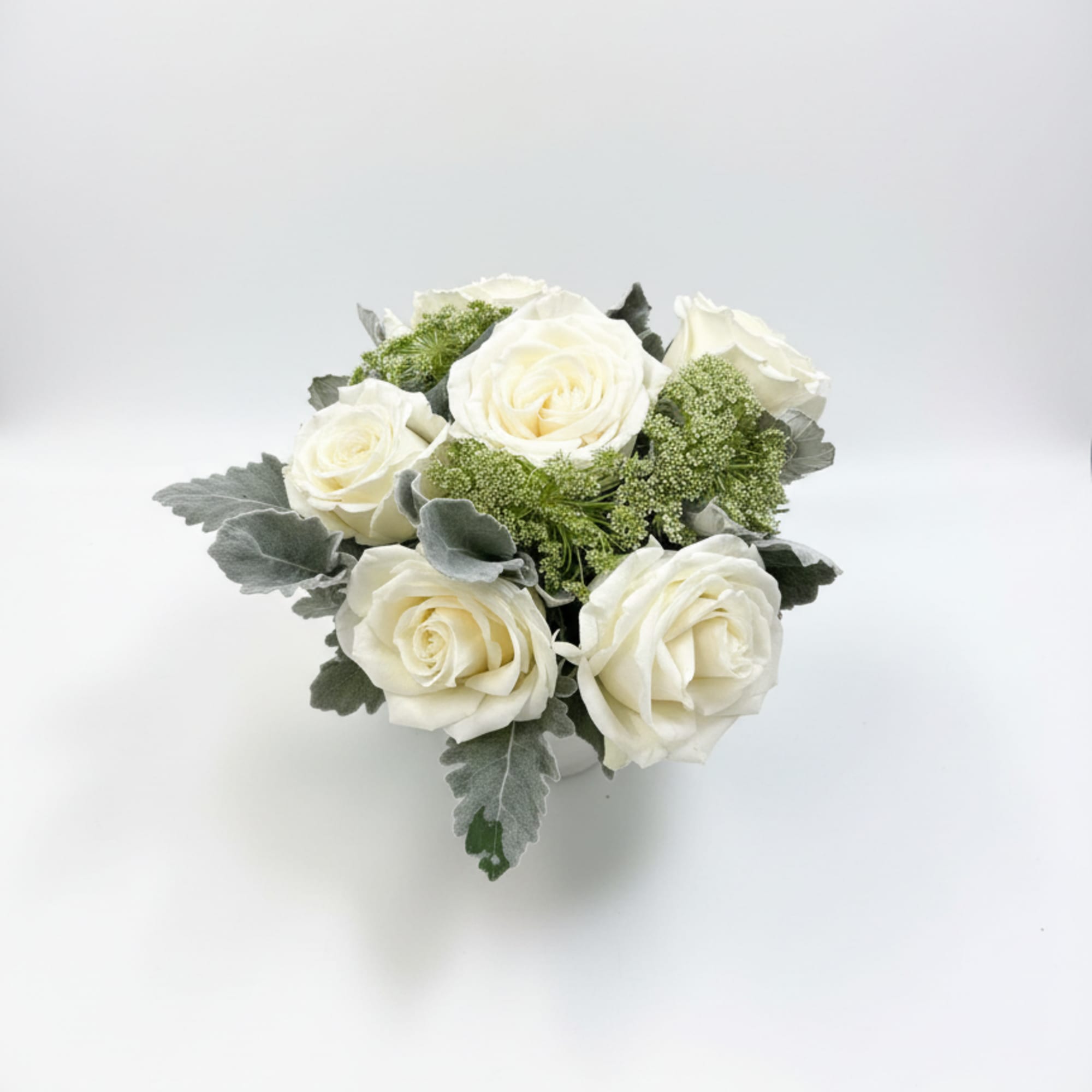 Creamy Playa Blanca roses with dusty miller and Queen Anne's lace in